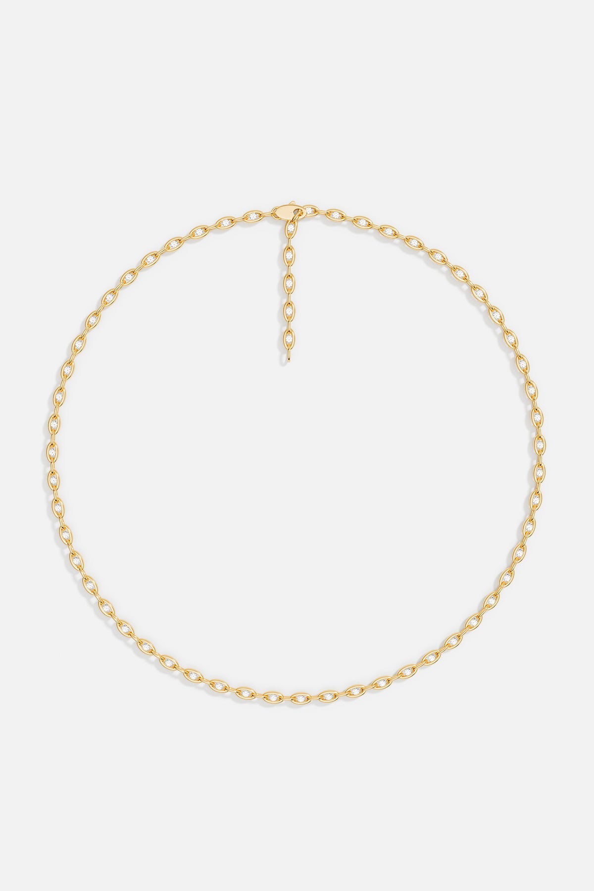 Necklaces APM Monaco. Yellow gold oval pavé chain necklace with small stones.