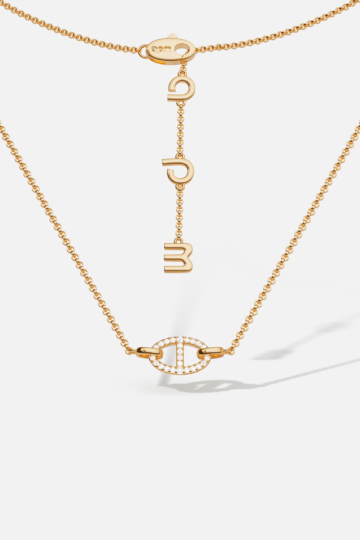 APM Monaco yellow gold necklaces with unique pendant on a white background