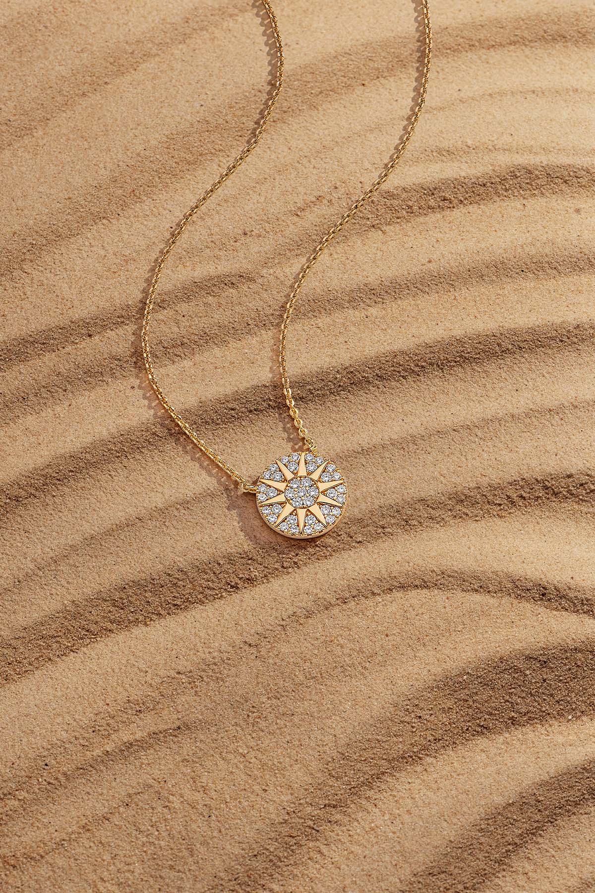 Necklaces APM Monaco: yellow gold sun pendant on a delicate chain.