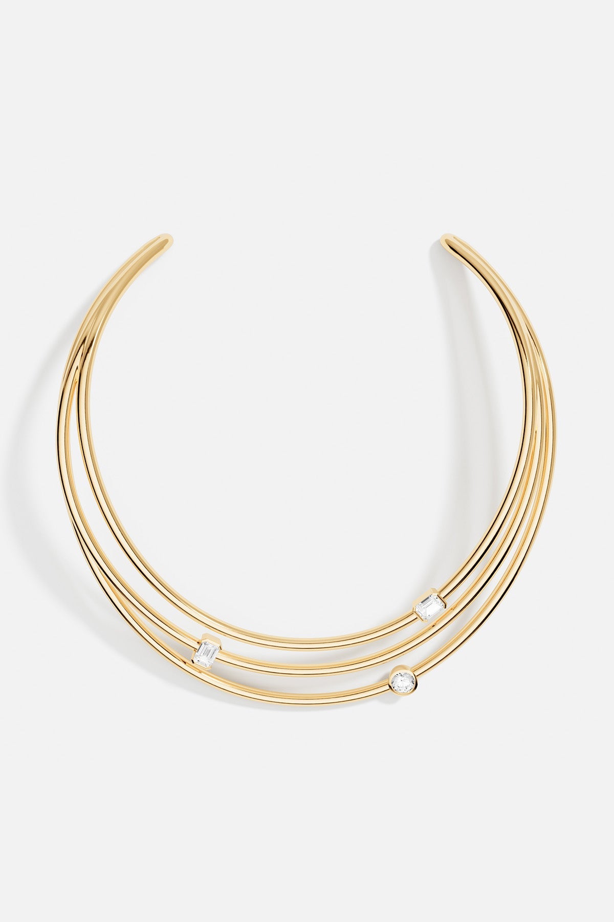 Necklaces APM Monaco yellow gold open-collar necklace with three rows featuring two baguette-cut diamonds and one round-cut diamond.