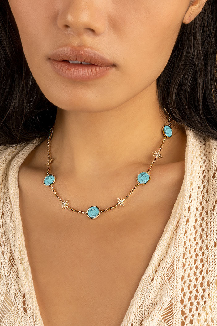 Necklaces APM Monaco choker with a yellow gold chain featuring turquoise lagoon pendants and star charms.