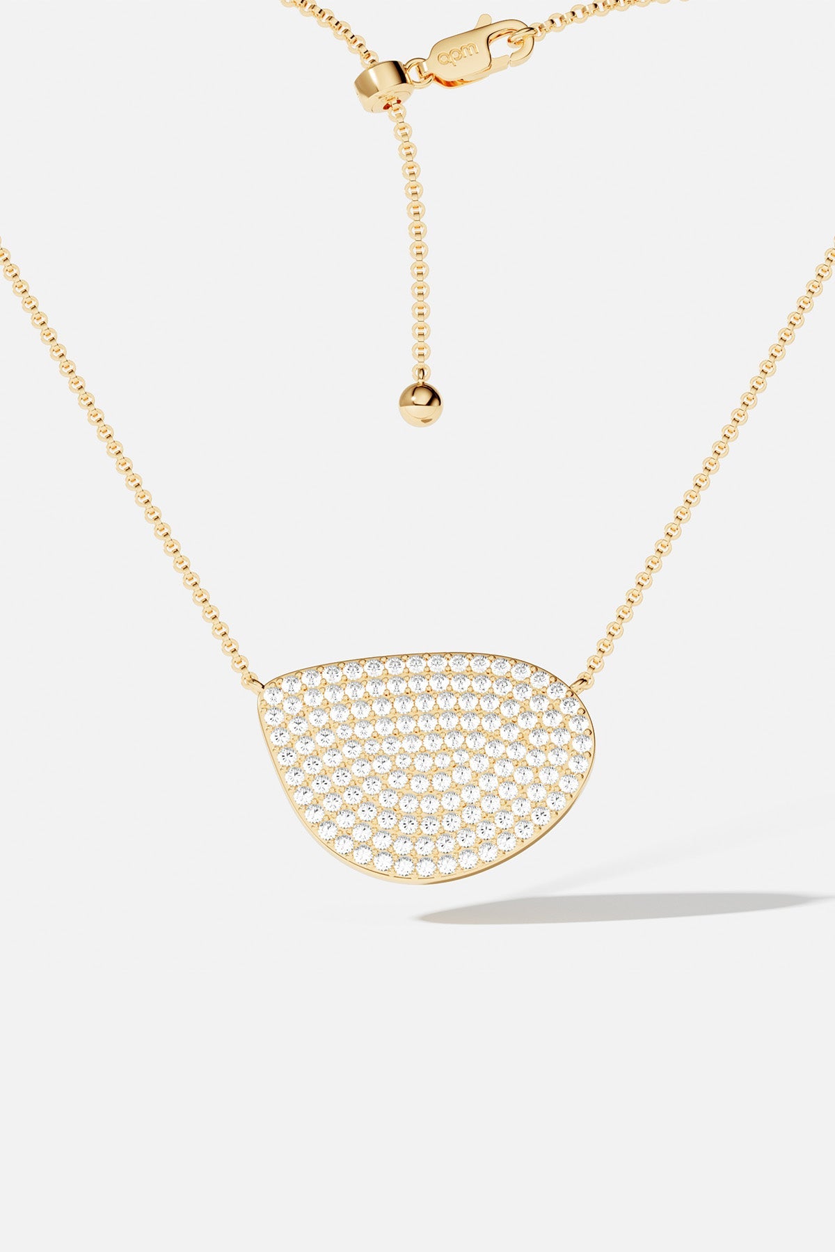 Necklaces APM Monaco adjustable yellow gold necklace with a pavé teardrop pendant encrusted with white crystals.