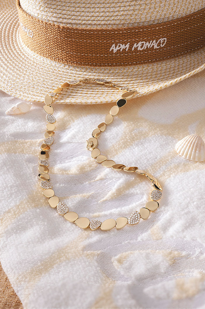 Necklaces APM Monaco, yellow gold galet choker with pebble-style beads.