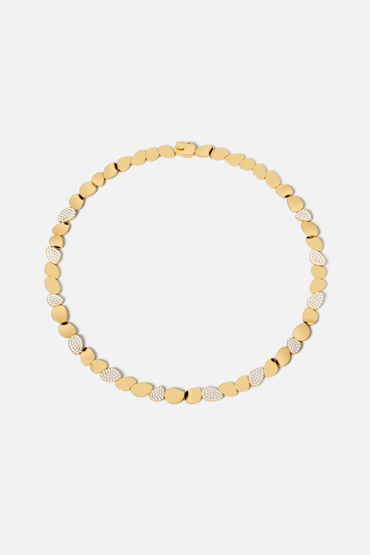 Necklaces APM Monaco, yellow gold choker with textured pebble pendants.