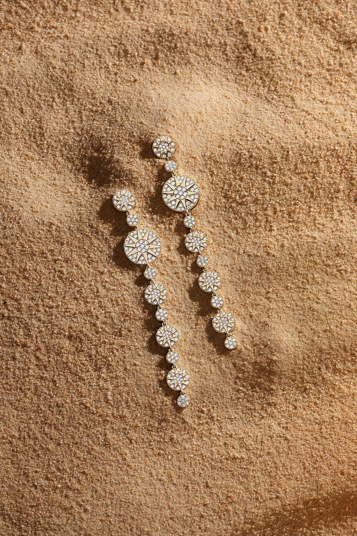 Earrings APM Monaco, yellow-gold long soleil diamond-drop earrings.