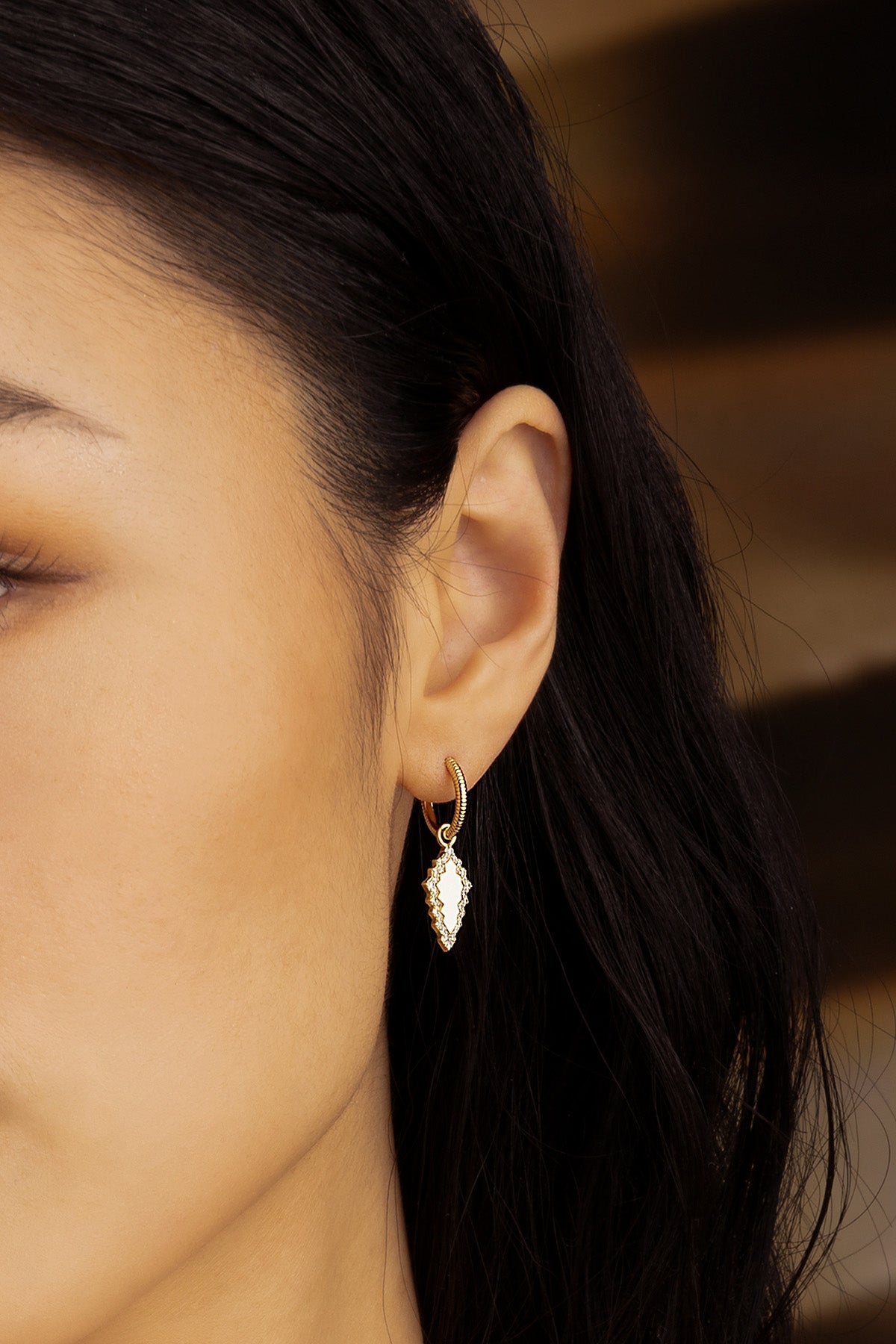 Earrings APM Monaco: yellow gold hoop with a white and gold pendant.