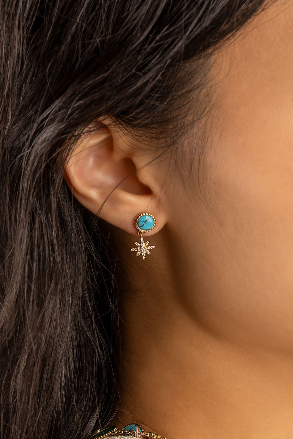 Earrings APM Monaco; yellow gold tone with turquoise stone and a starburst charm, Lagoon Meteorites style.