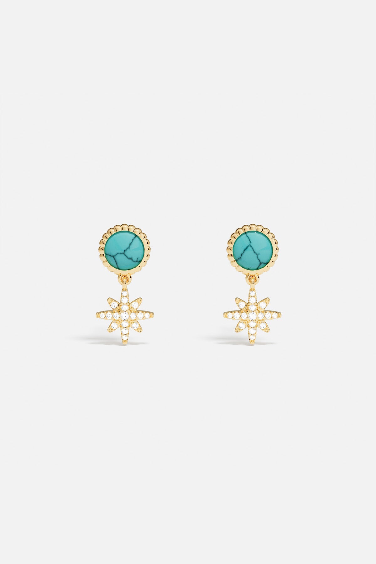 Earrings APM Monaco, gold-tone with a turquoise gemstone and a pavé star of clear crystals.
