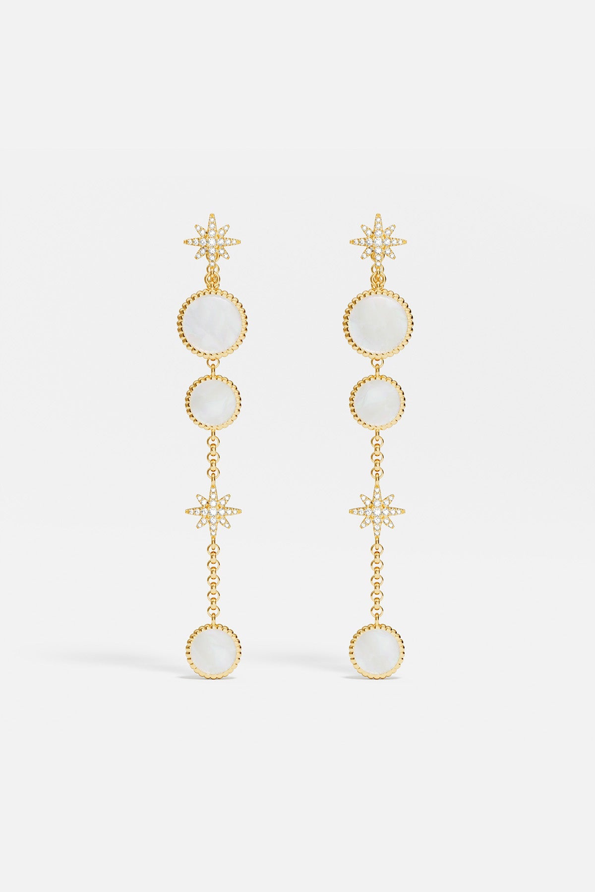 Earrings APM Monaco ear jackets, white nacre with a star motif and round opalescent stones