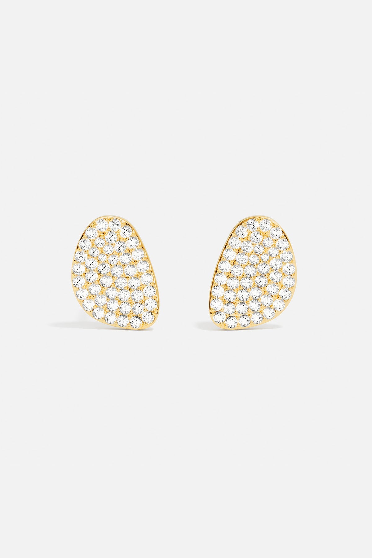 Earrings APM Monaco pair of yellow gold pavé galet stud earrings with white diamonds.