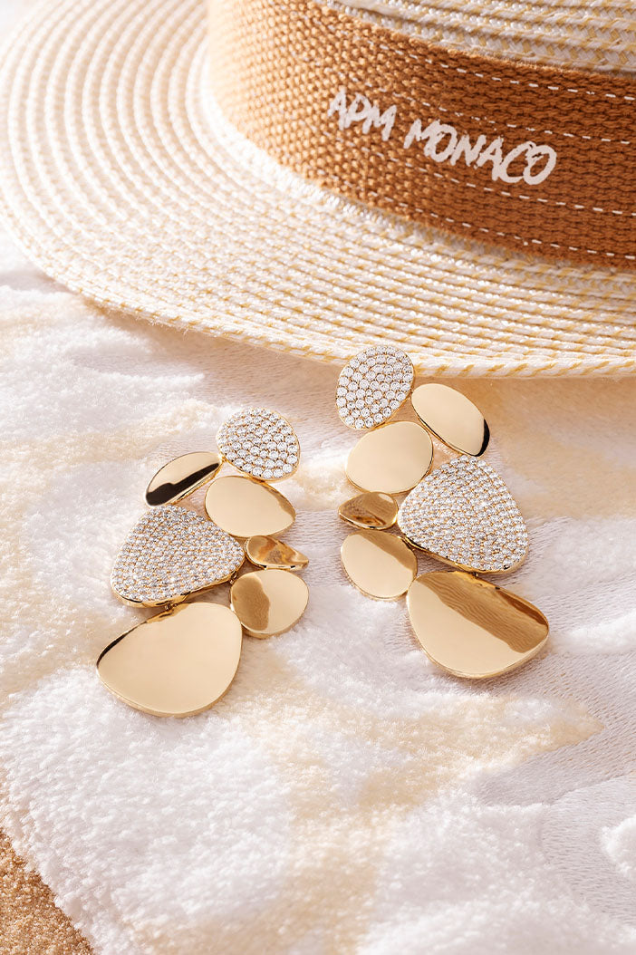 Earrings APM Monaco, statement galet earrings with pebble-inspired design; color and stones not clear; APM Monaco fashion jewelry.