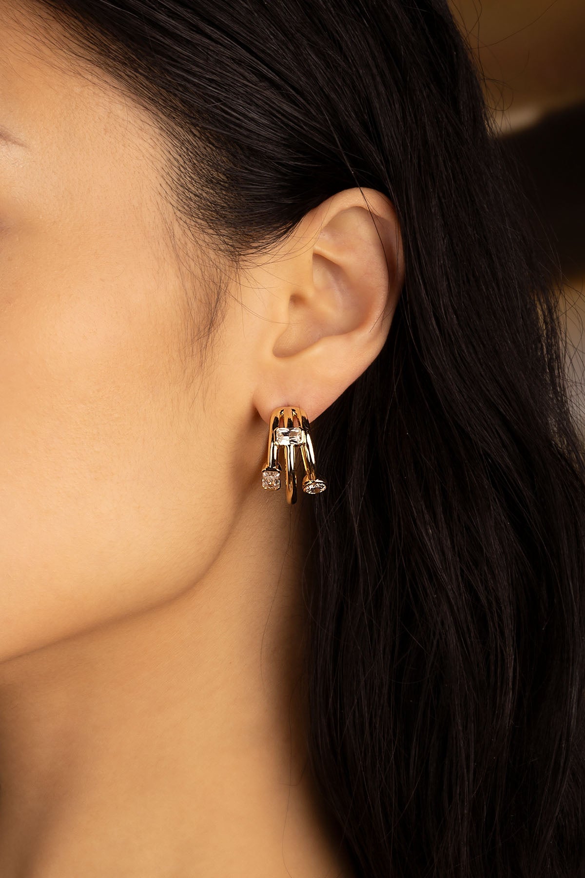 Earrings APM Monaco: yellow gold hoop earrings with pavé cubic zirconia accents.