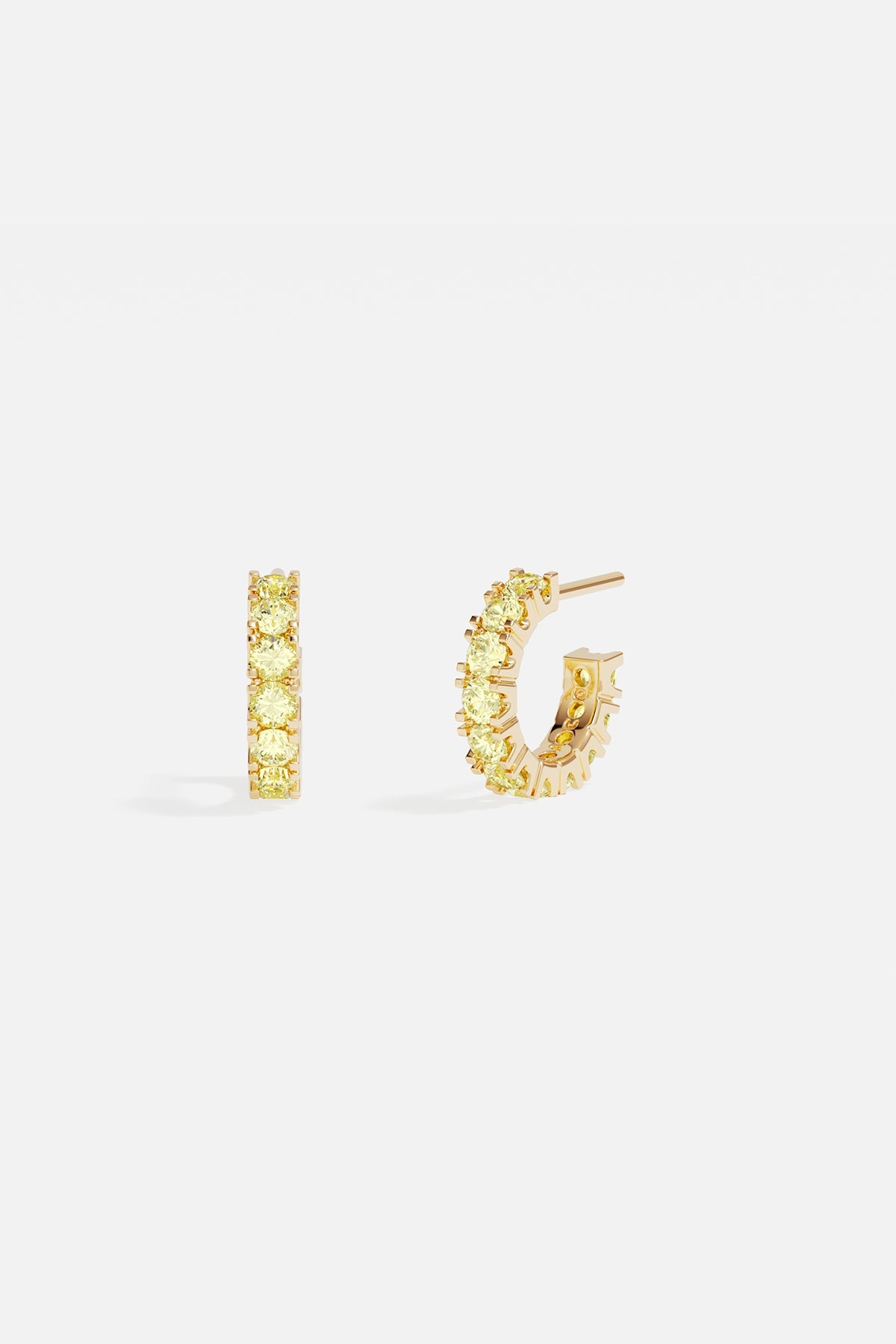 Earrings APM Monaco pave huggie earrings in yellow gold with yellow stones.