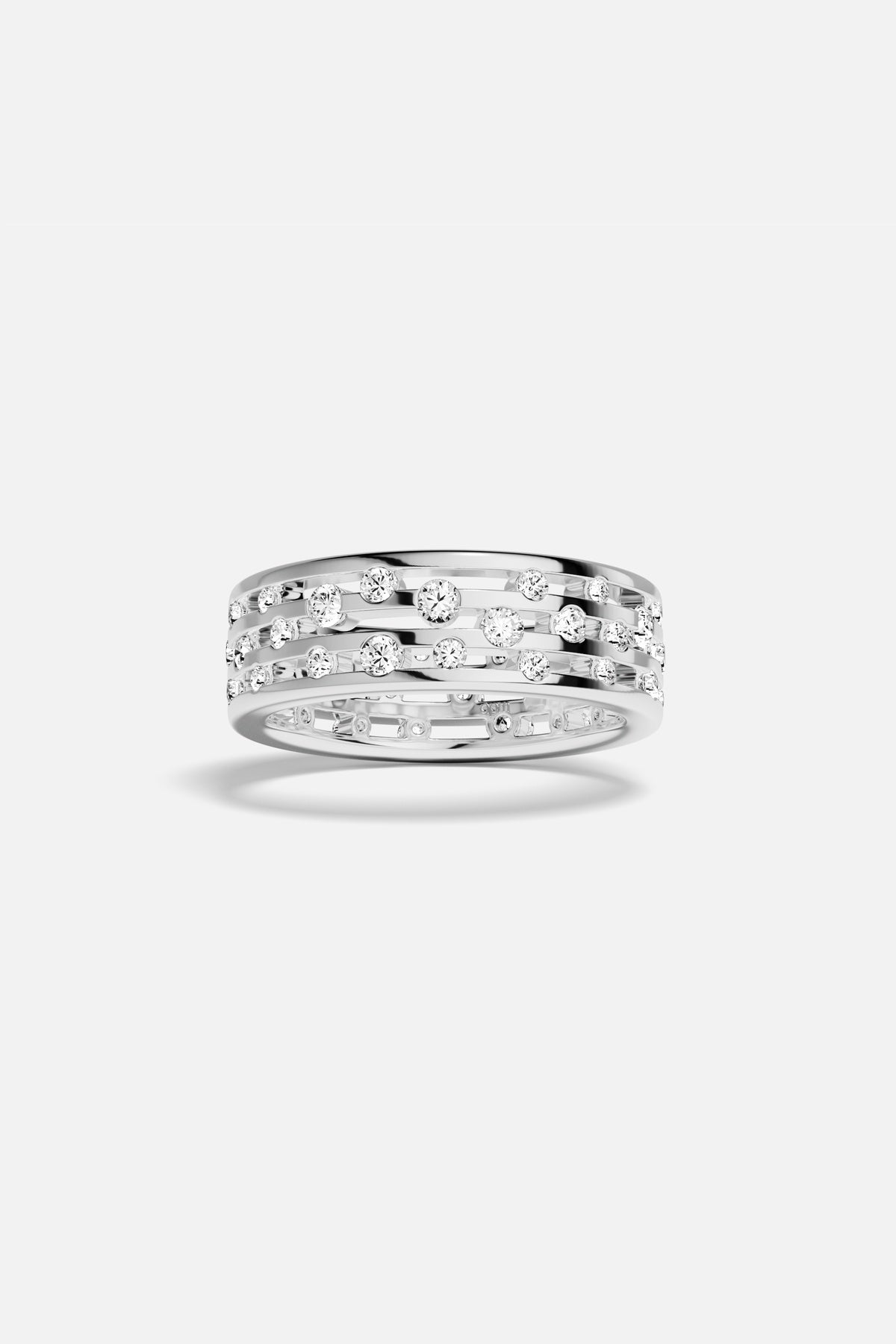 APM Ring in rhodium finish, scattered sparkles across open bands, effortlessly modern.