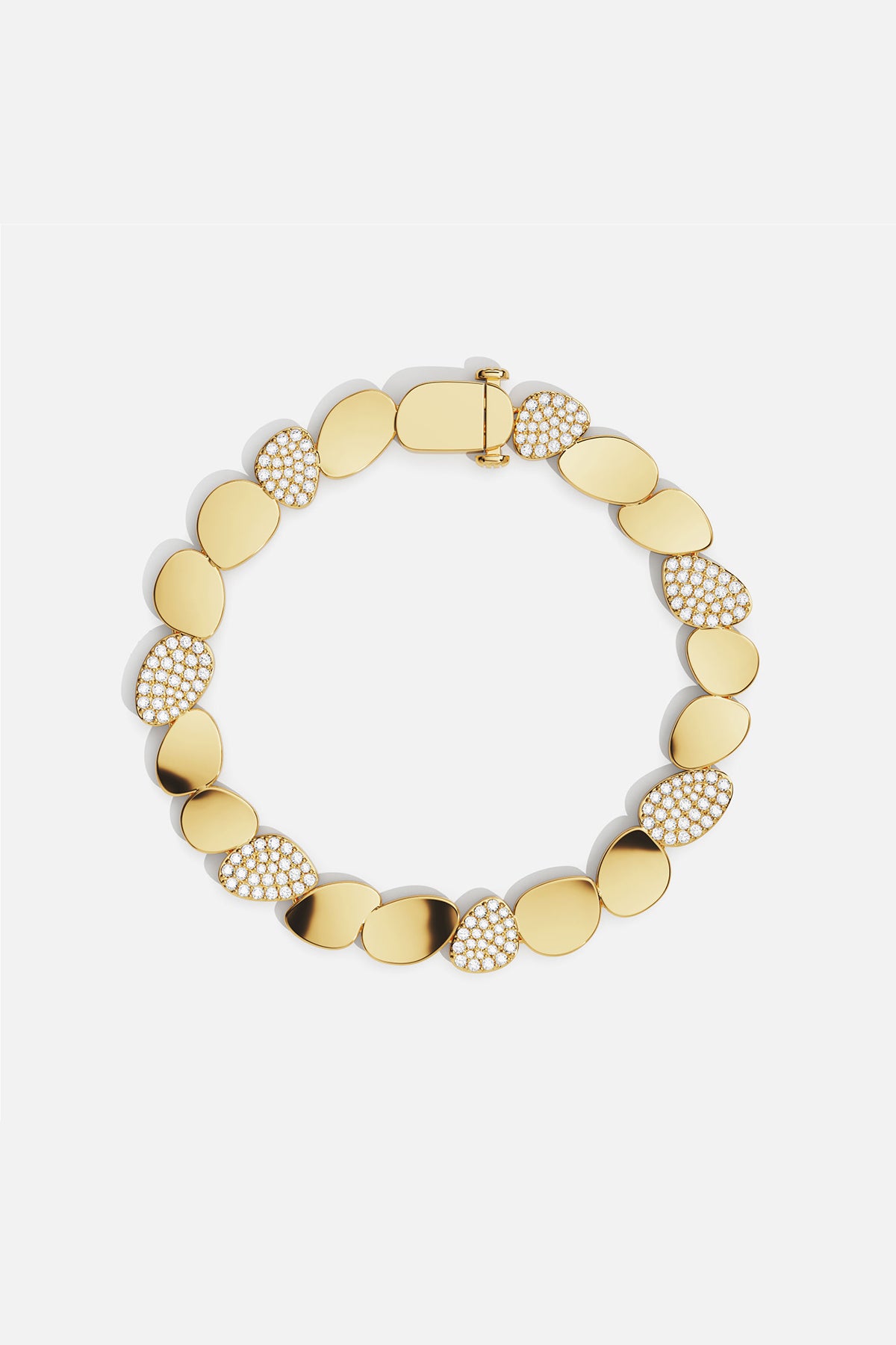 APM Monaco bracelet, golden pebbles shimmering with quiet elegance.