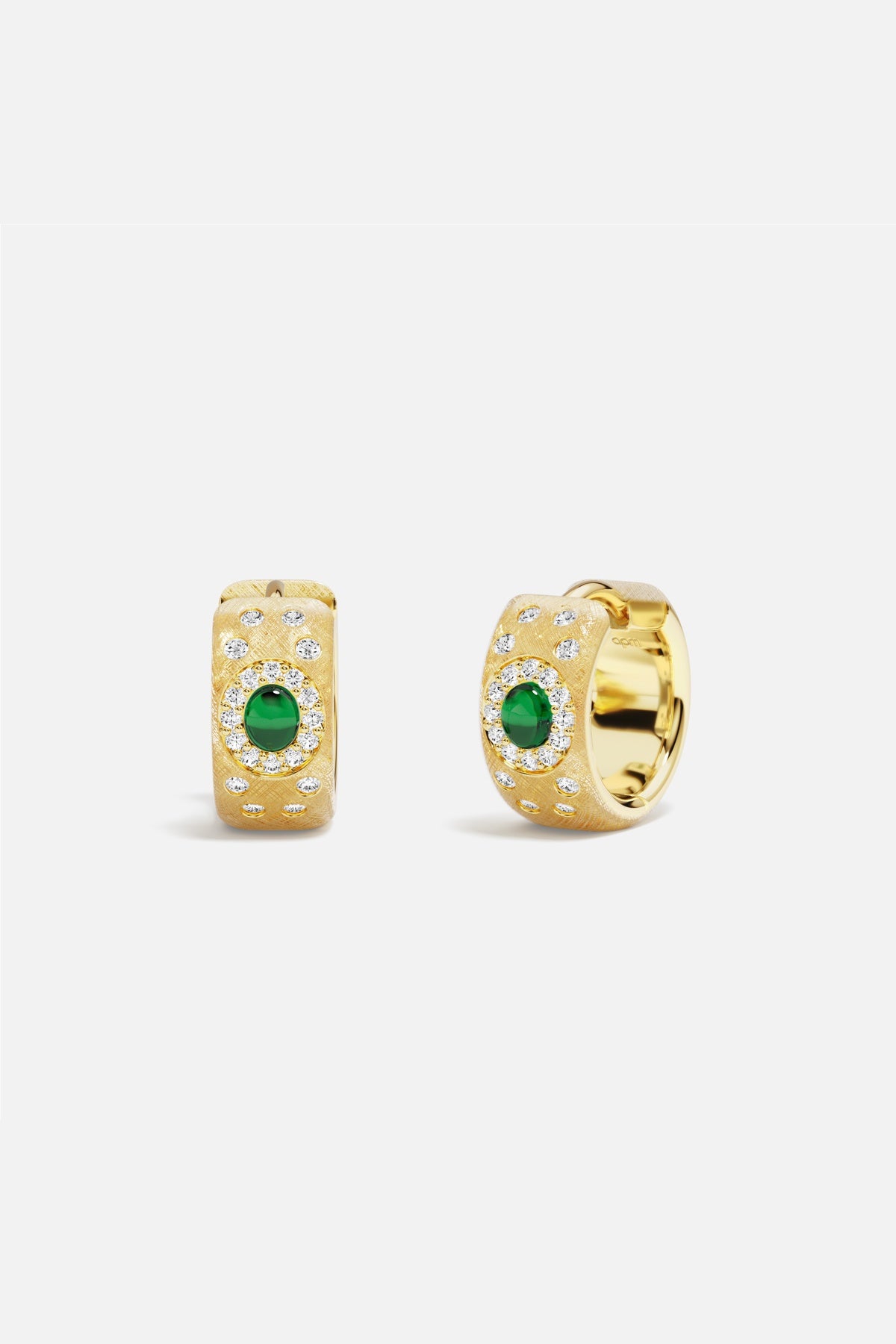 APM Hoop Earrings in golden color, glowing with emerald charm and quiet elegance.