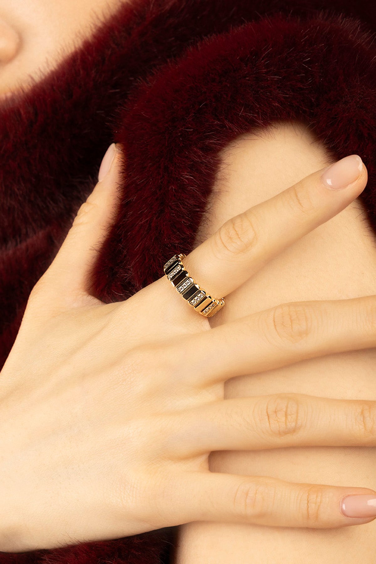 Woman wearing APM Morse Ring, a golden whisper of quiet elegance.