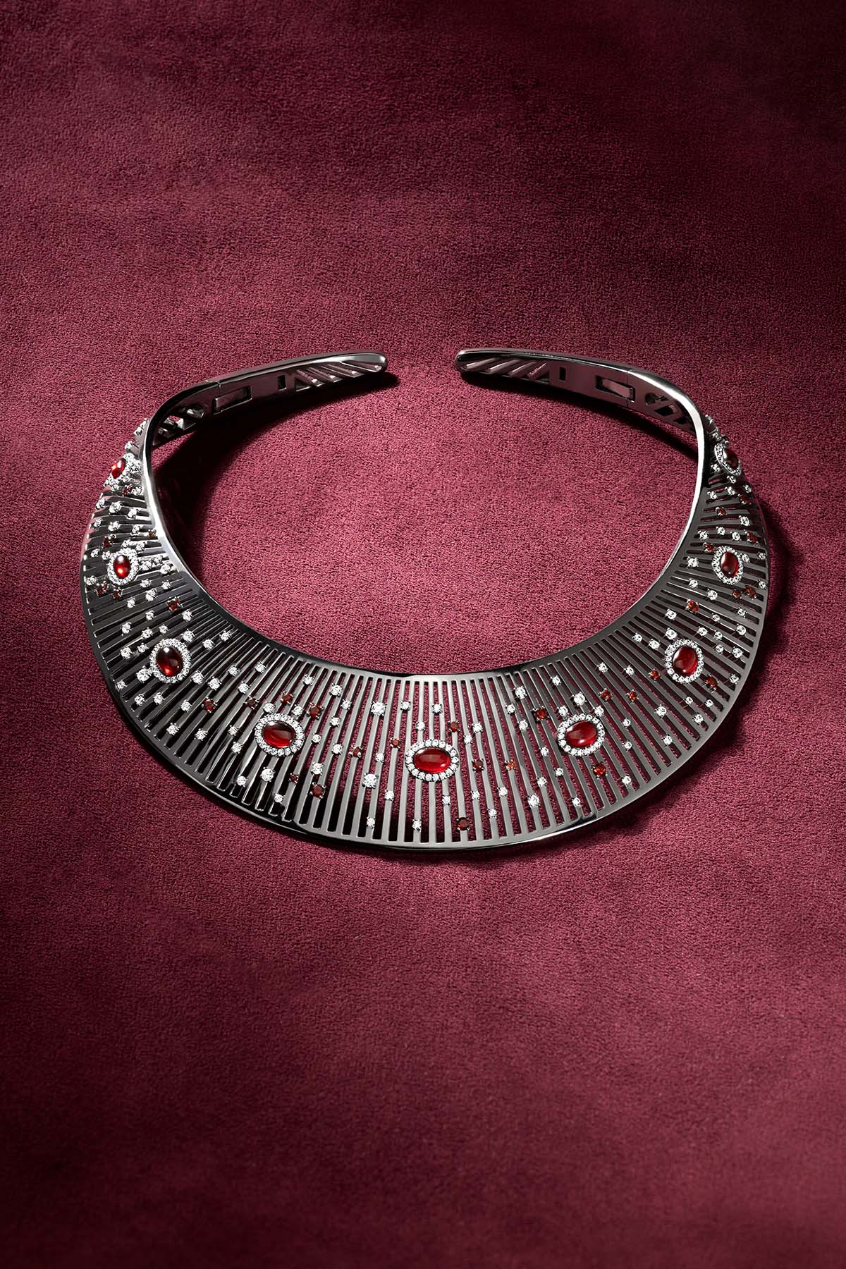 APM Monaco statement collar, a bold constellation of red and sparkling stones.