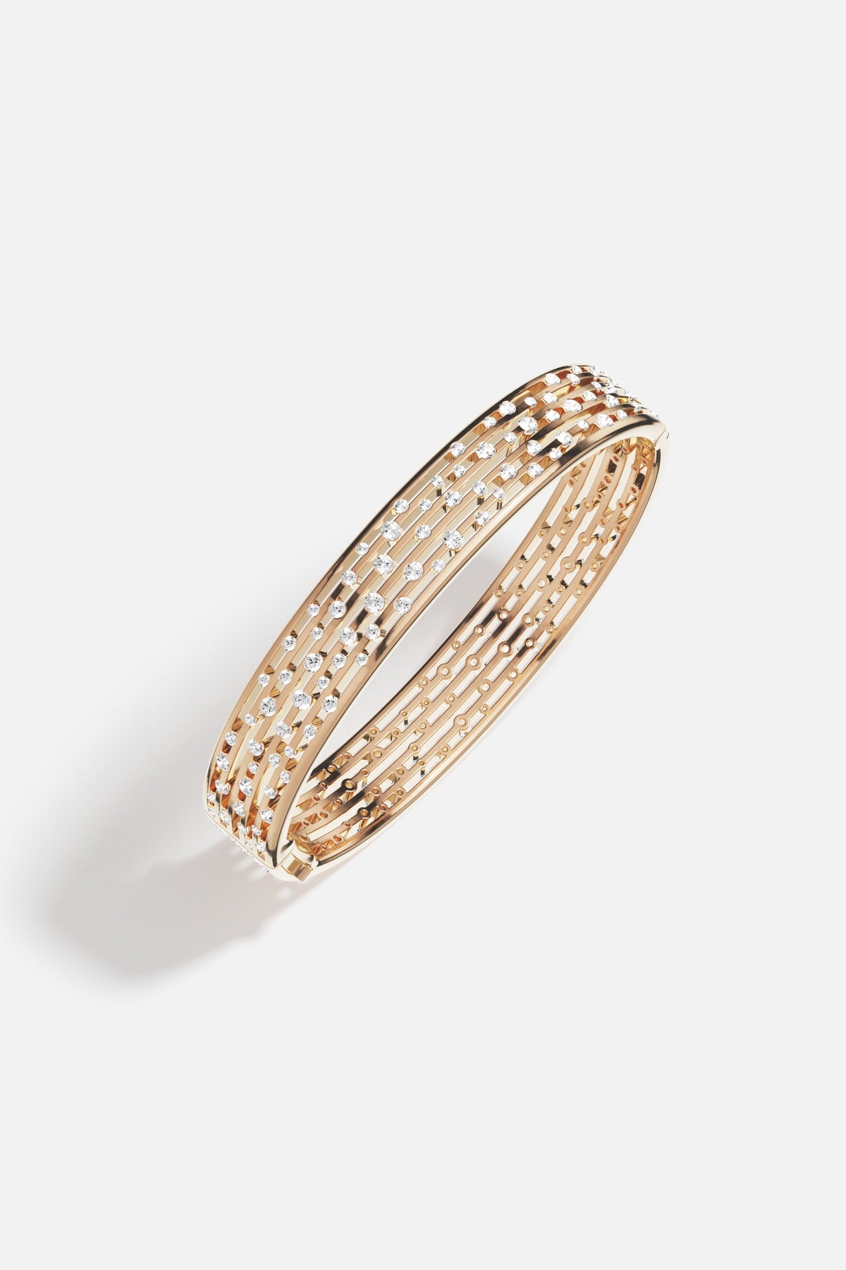 APM Monaco bangle in golden alloy, scattered with stardust sparkle for effortless elegance.