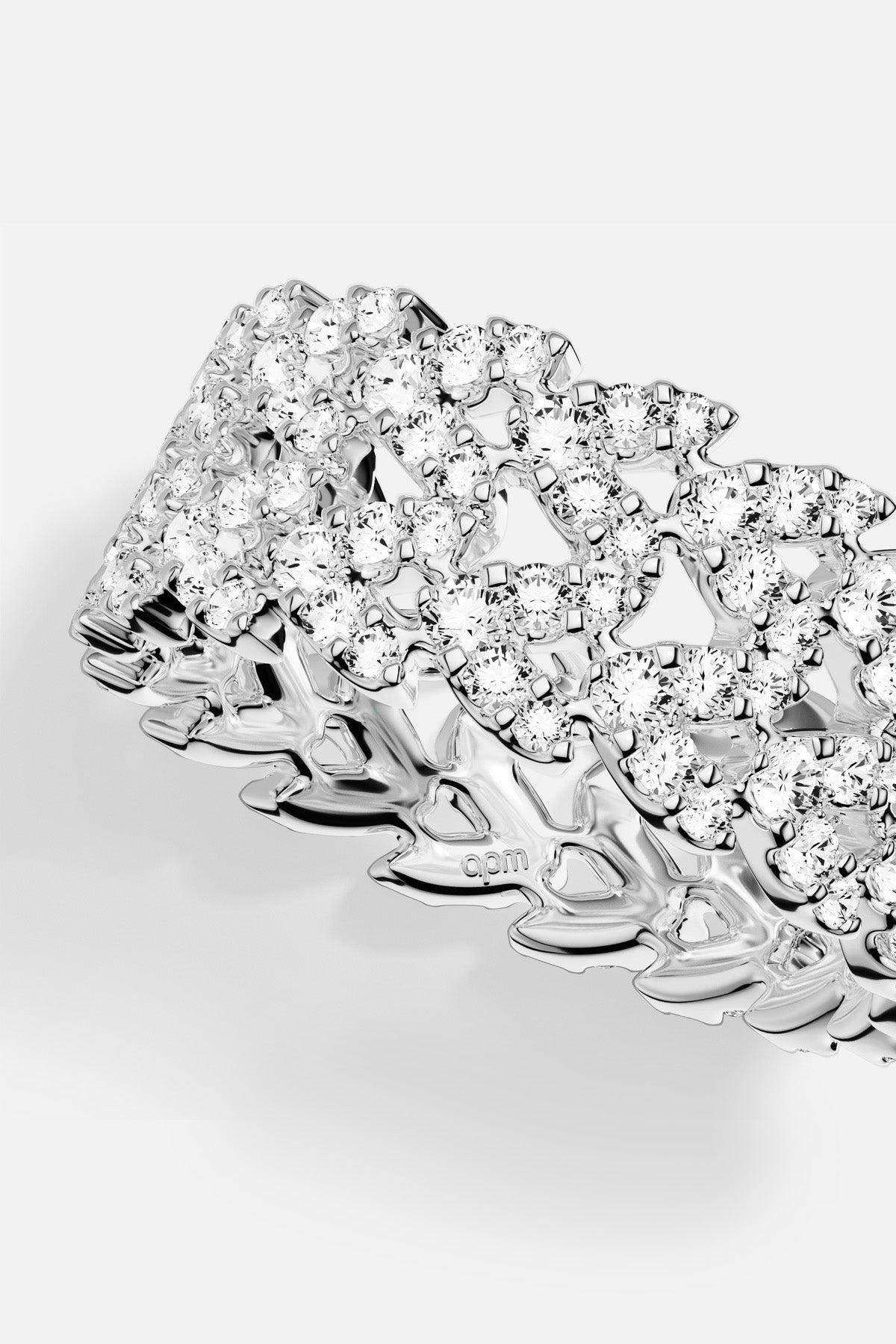 APM Ring in rhodium finish, a shimmering lace of light around the finger.