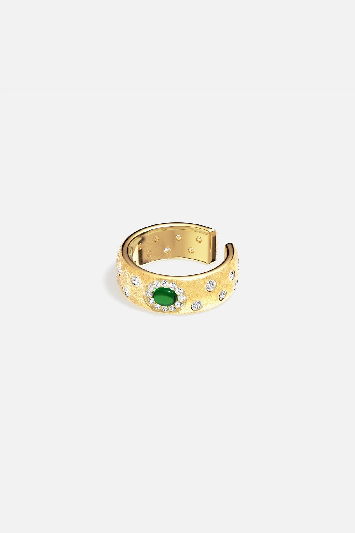 APM Ring in golden hue, a green stone glowing with quiet elegance.