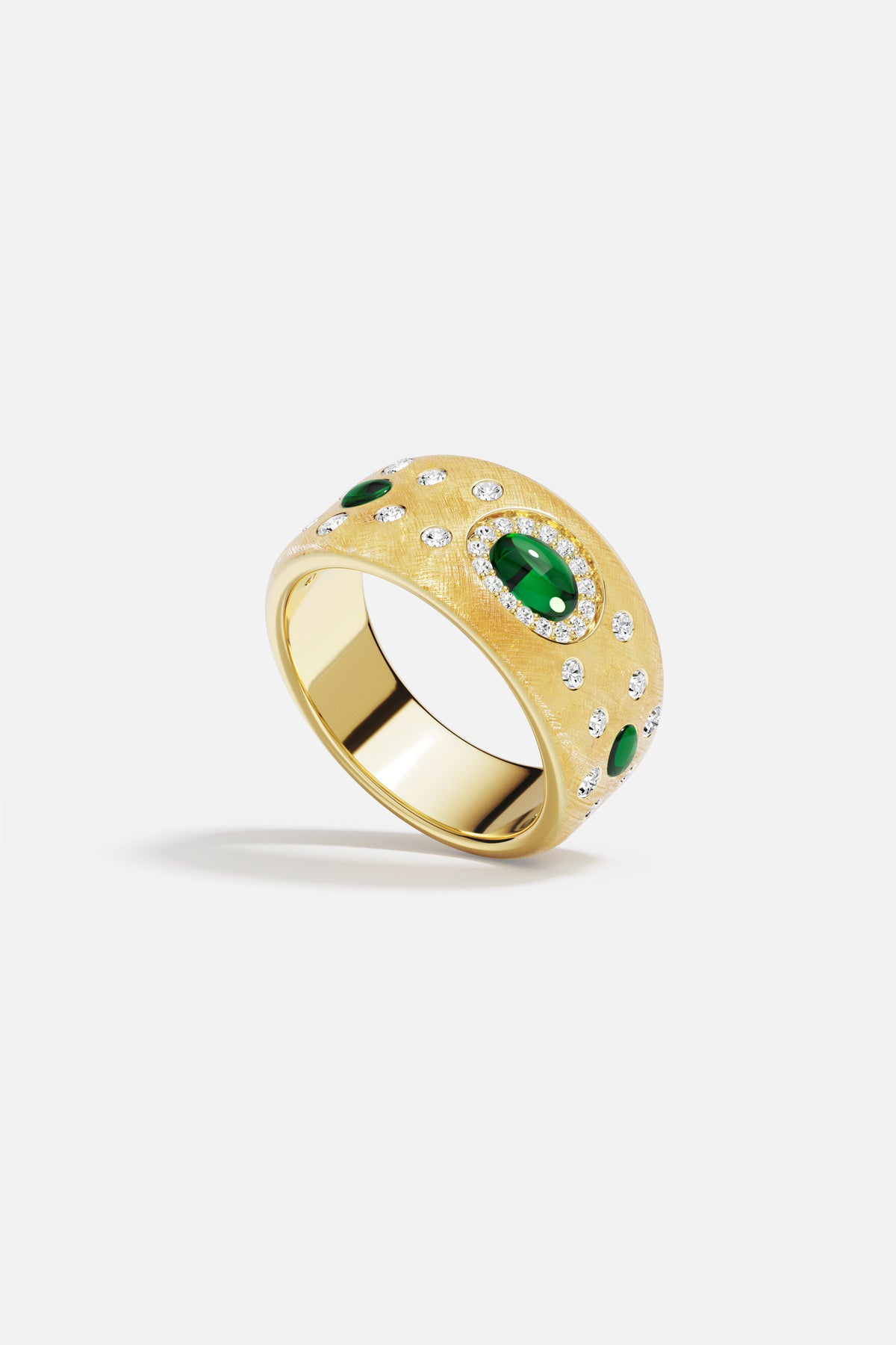 APM Ring in brushed gold color, scattered with emerald hues and starlit sparkle.