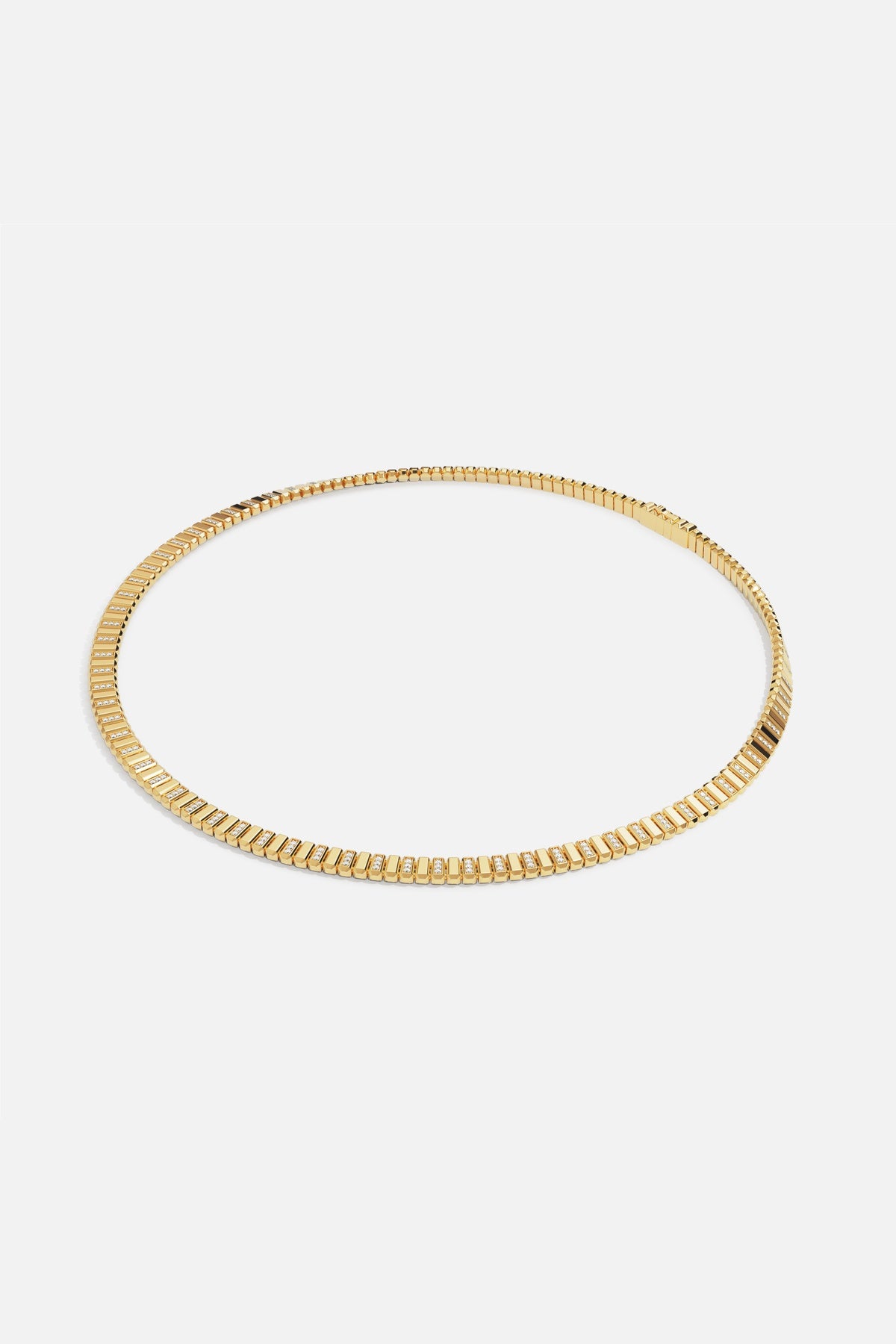 APM Necklace in golden hues, sleek architectural lines with a modern radiance.