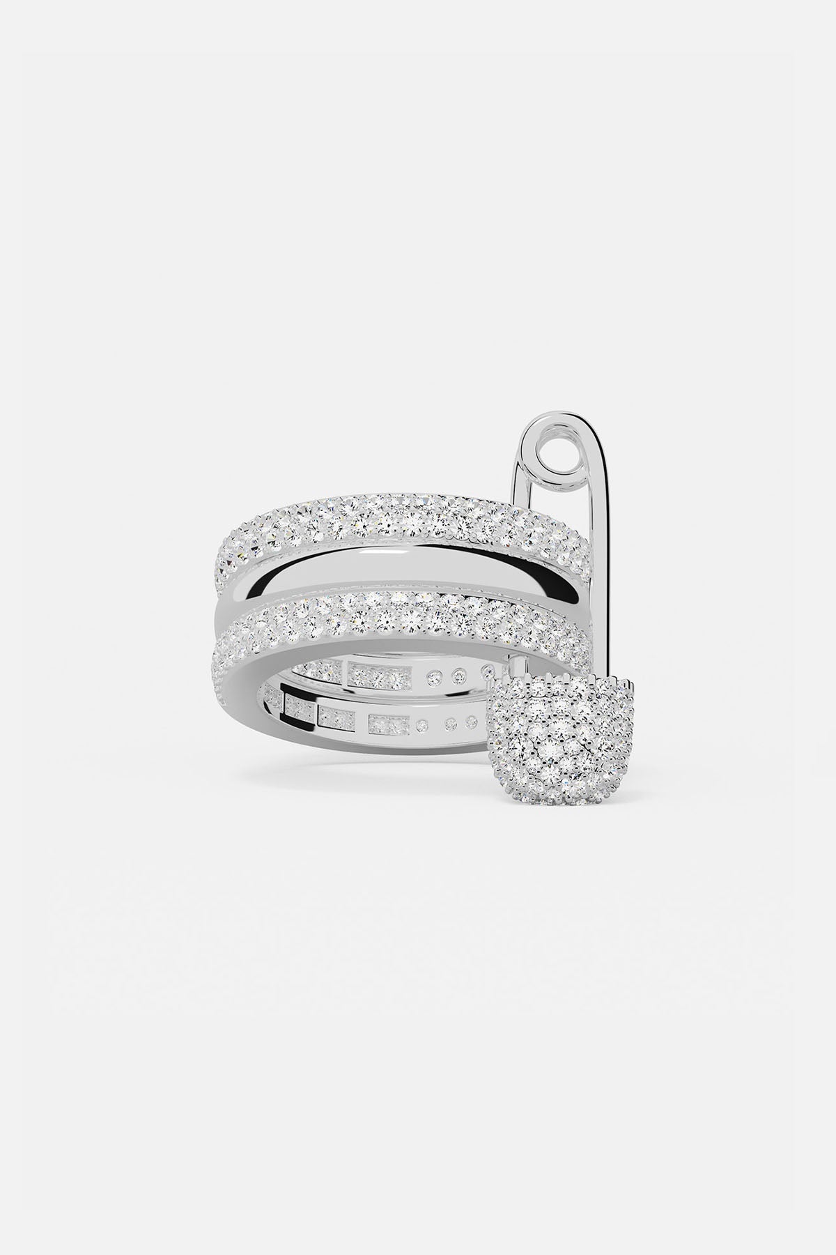 Rings APM Monaco, white ring with triple-hoop design and safety-pin motif with pavé diamonds.