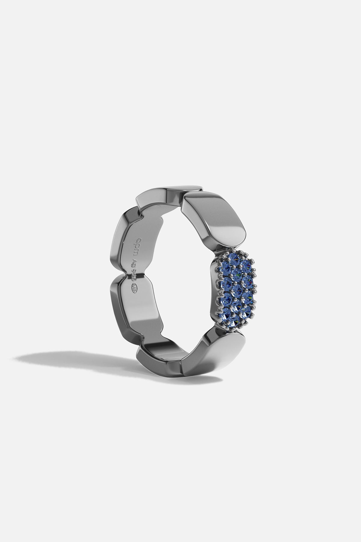 Dark Grey silver ring with blue stones on a white background