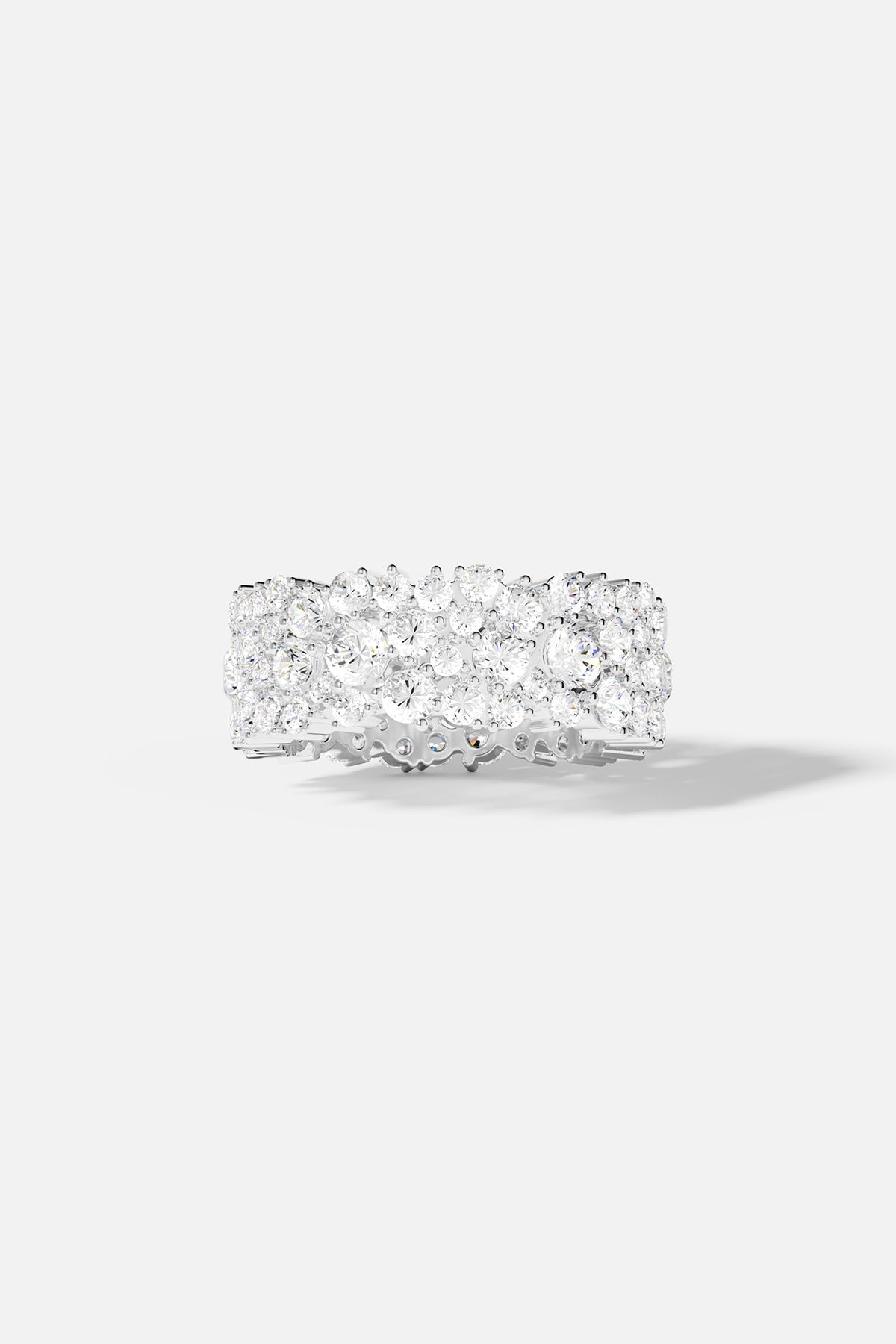Rings APM Monaco, silver-tone band with three rows of pavé clear stones.