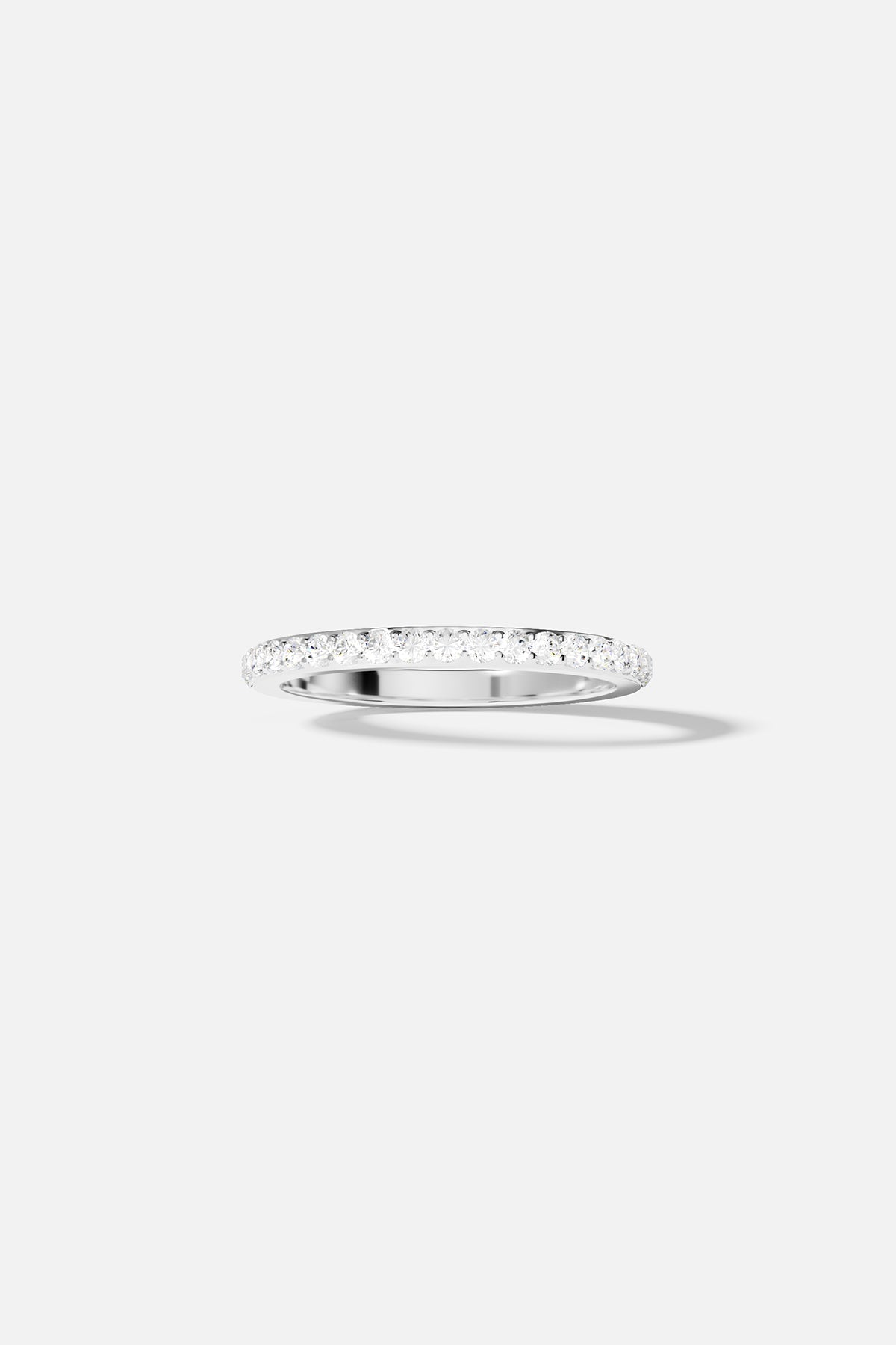 Rings APM Monaco, silver-tone ring with a linear pavé of small stones along the top band.