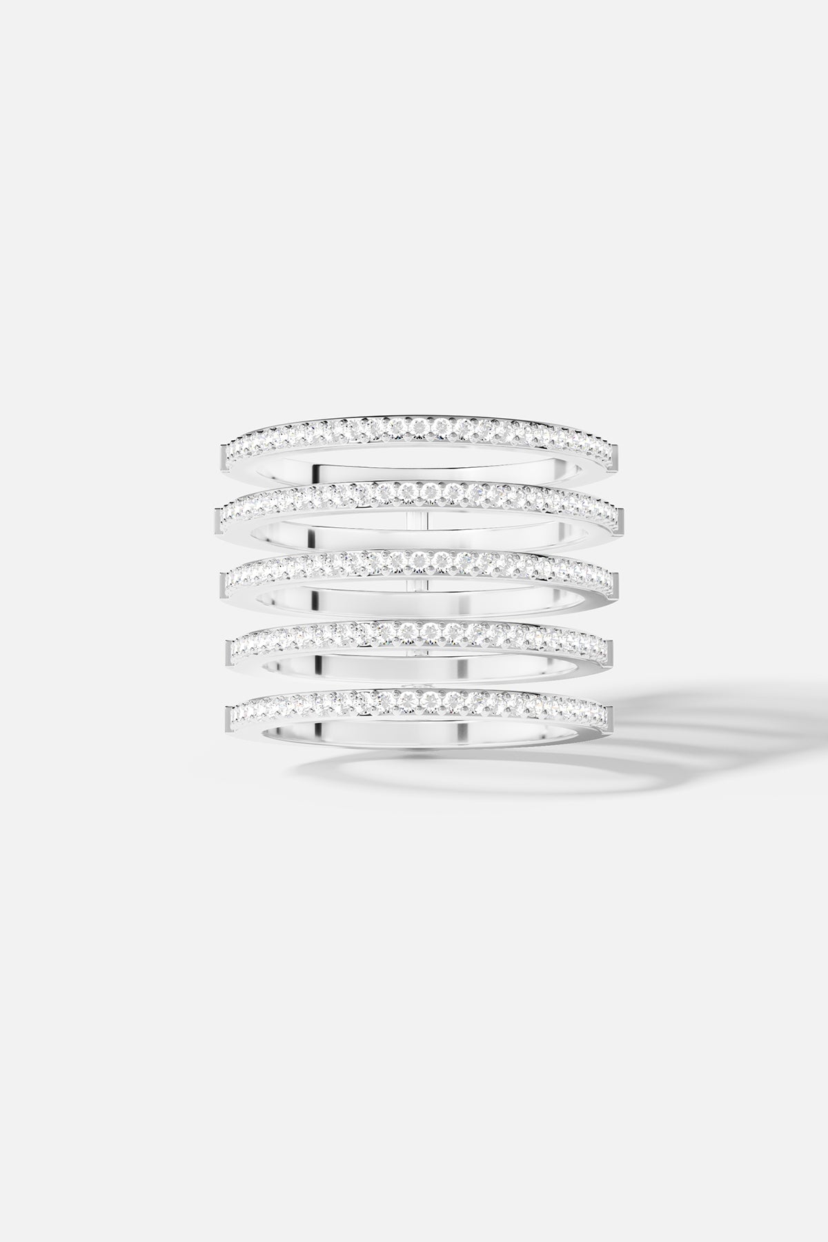 Rings APM Monaco, white gold linear pavé diamond rings, stacked with white diamonds along the bands.