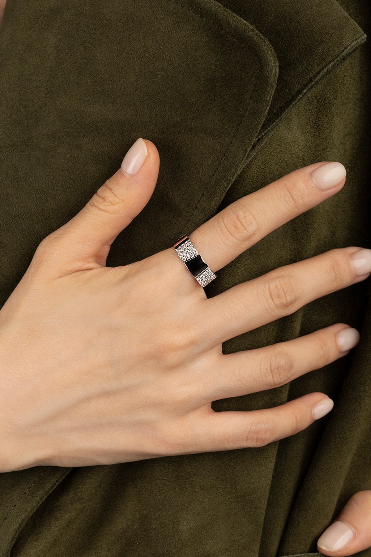 Hand wearing a APM Monaco Pavé Ring in silver