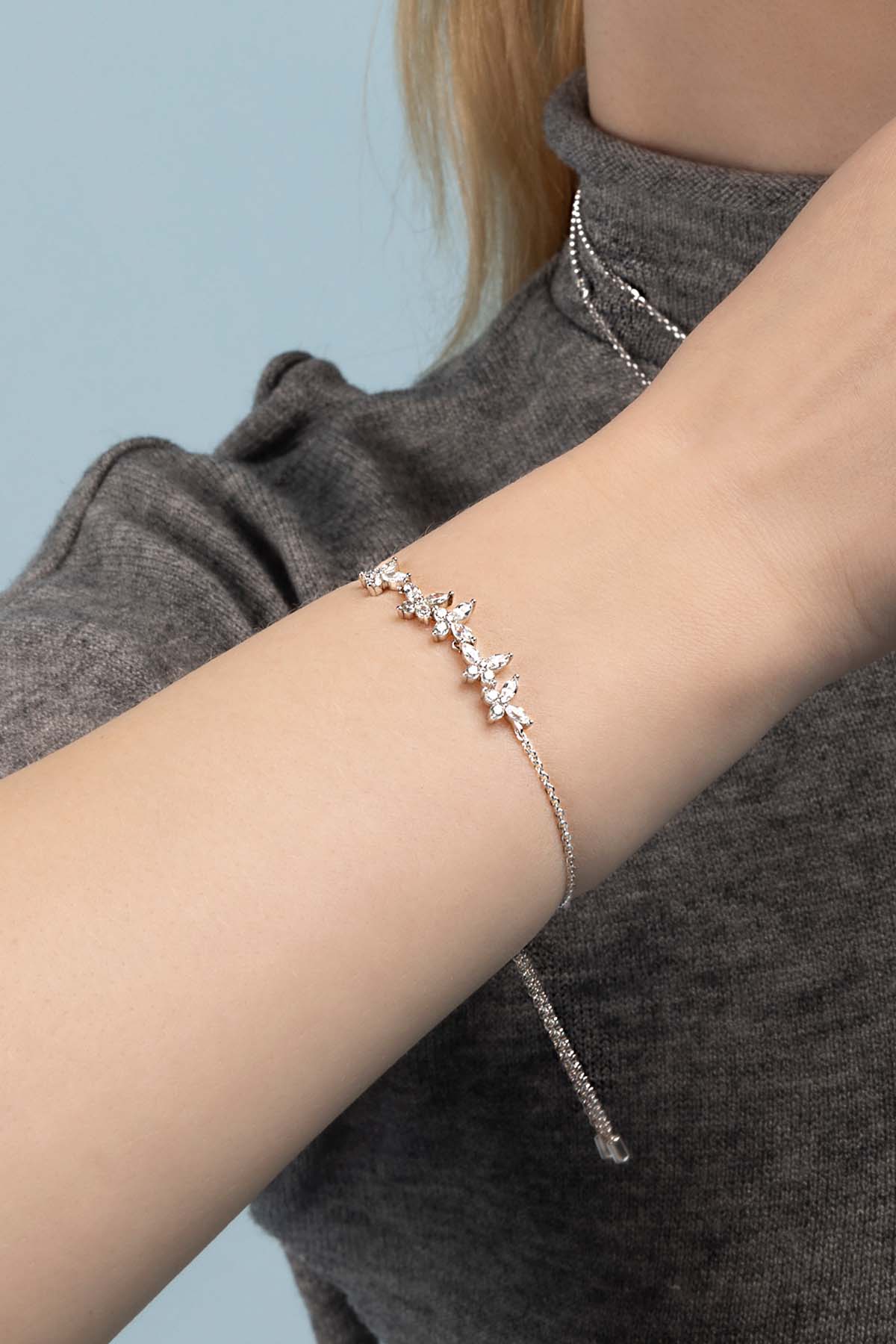 Bracelets APM Monaco. Silver-tone adjustable bracelet featuring butterfly motifs with clear pavé stones.