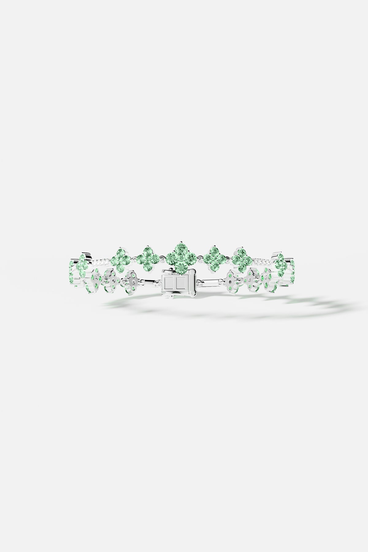 Bracelets APM Monaco. pastel-green stones set in a silver pavé bracelet.