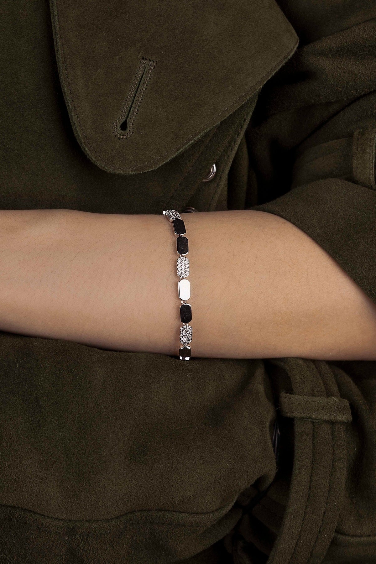 Silver bracelet on a wrist