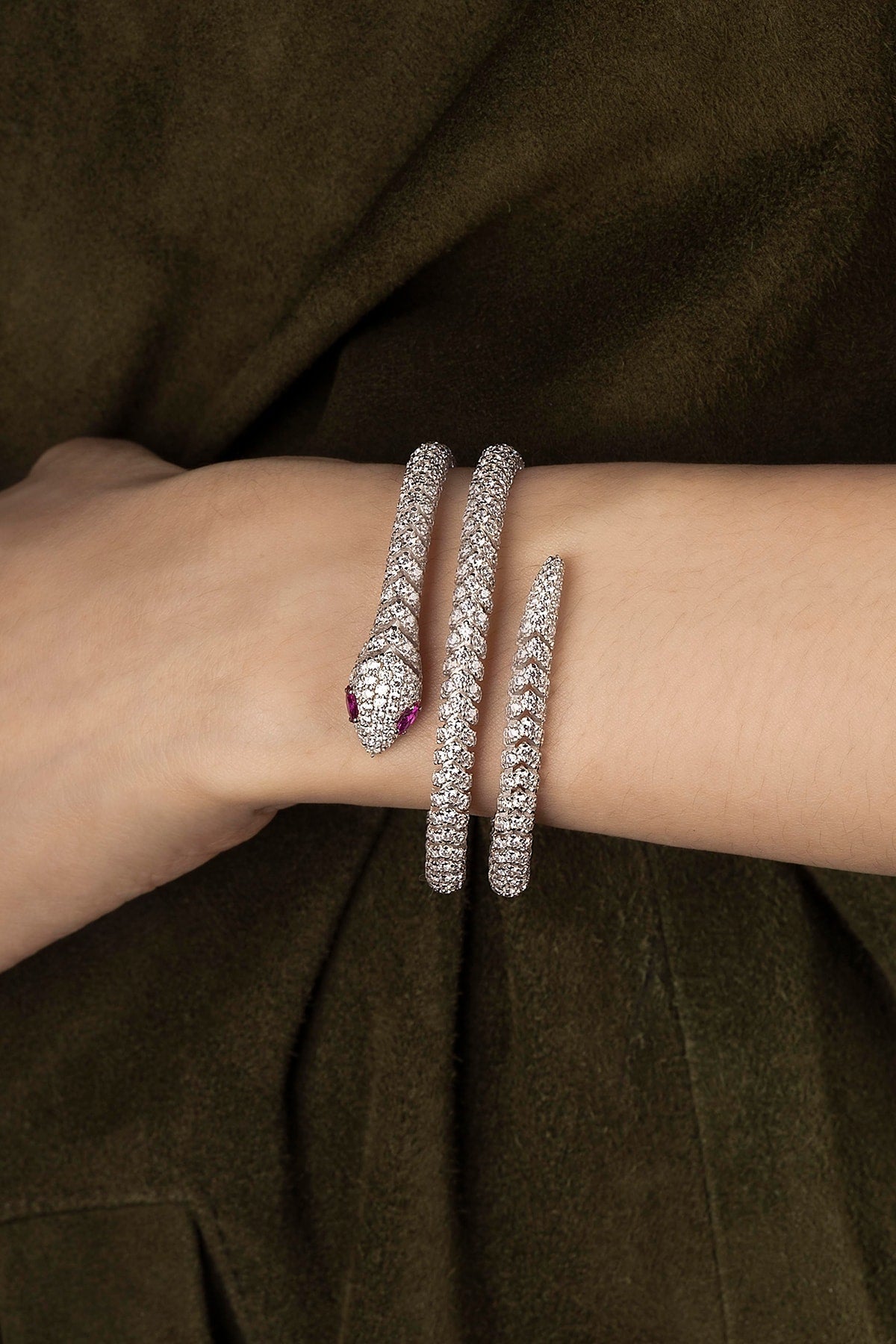 Bracelets APM Monaco pavé double-wrap snake bangle in silver worn on hand