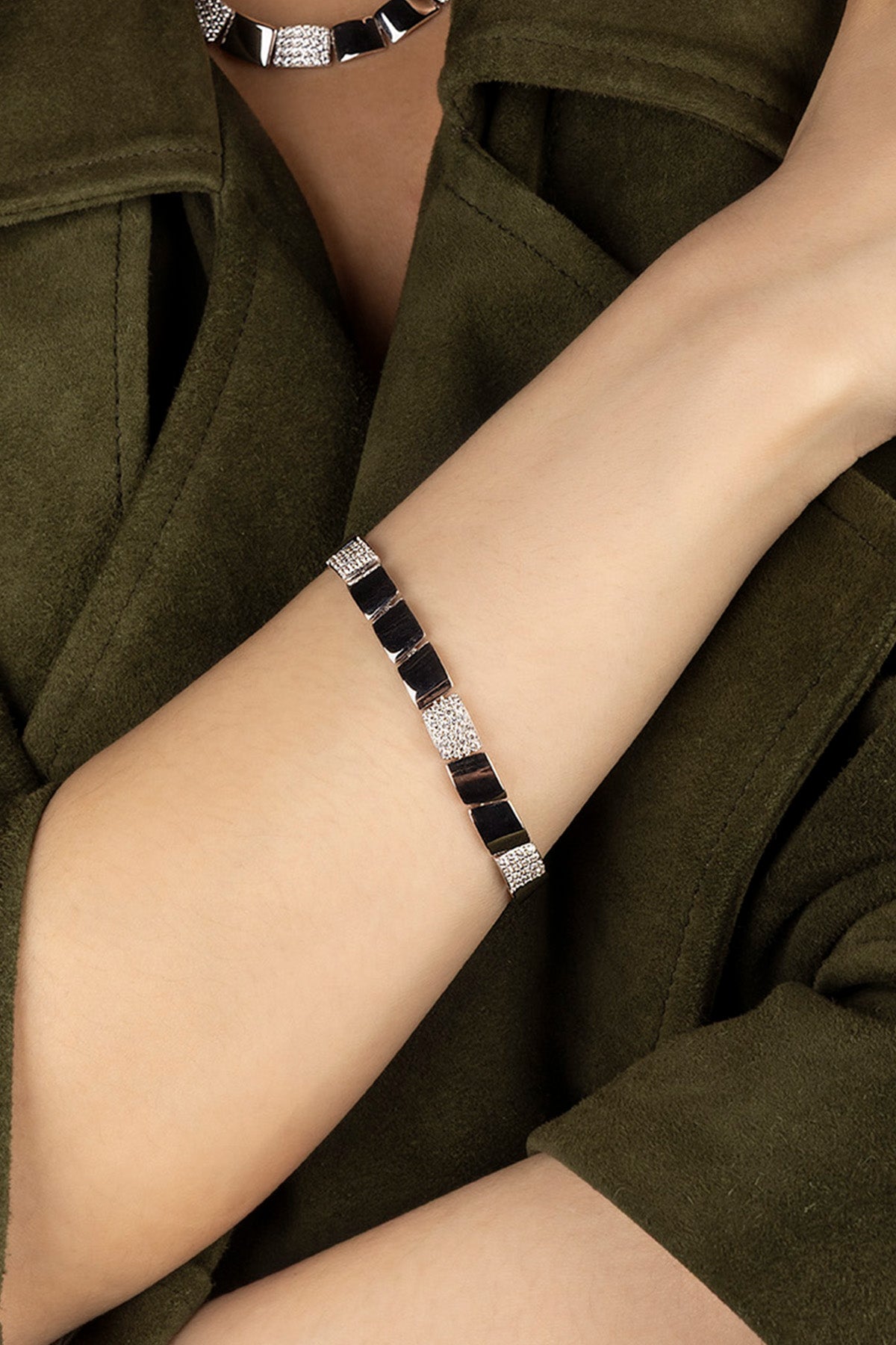 APM Monaco Pavé Bracelet in silver on a person's wrist 