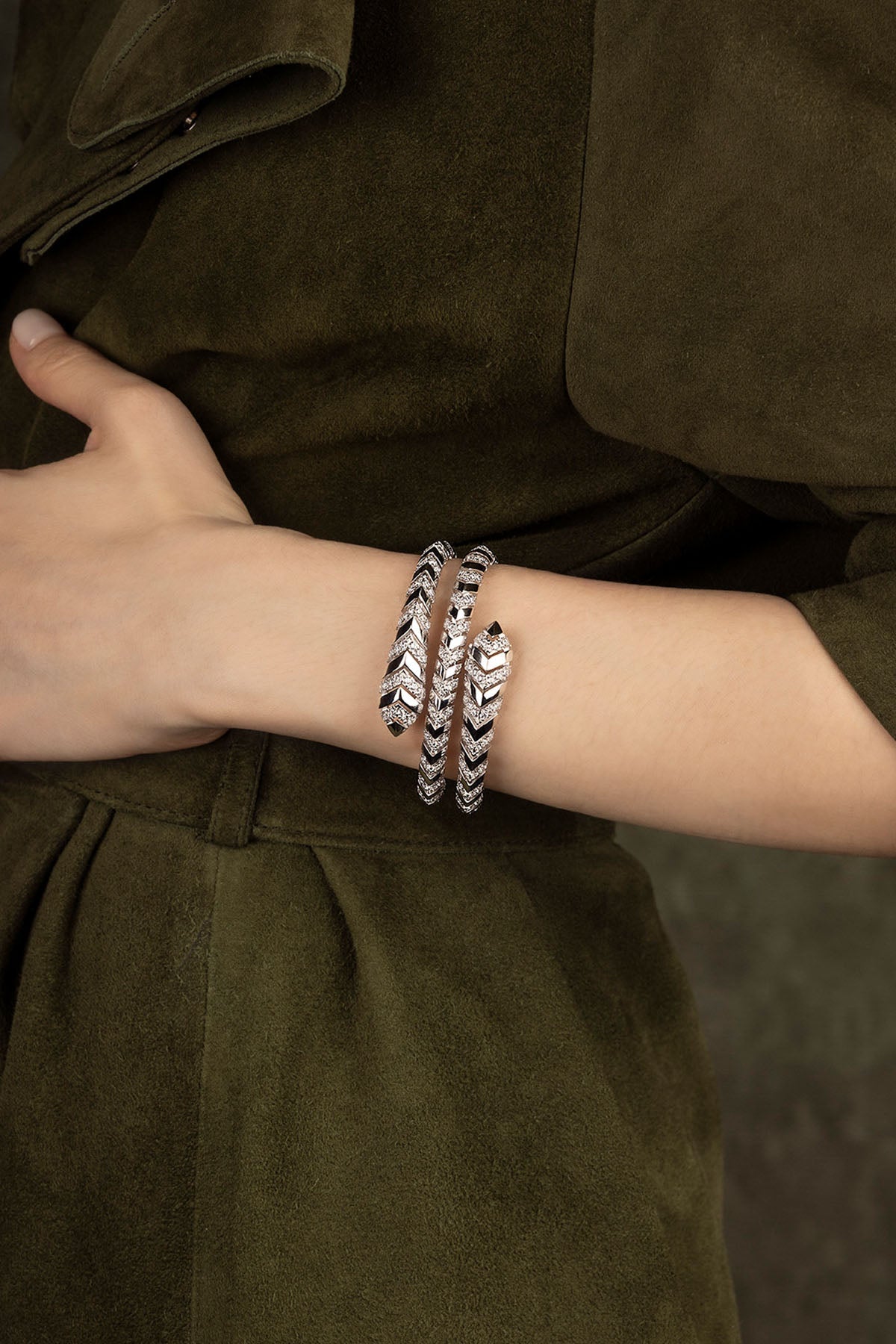 APM Monaco Kaa Double Wrap-Around Bangle in silver worn on hand