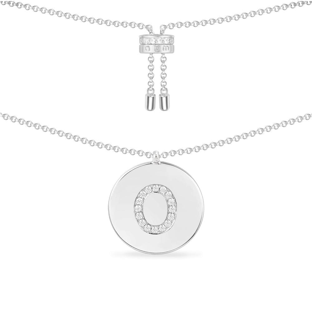 Necklaces APM Monaco white pavé diamond letter O pendant on a silver chain.