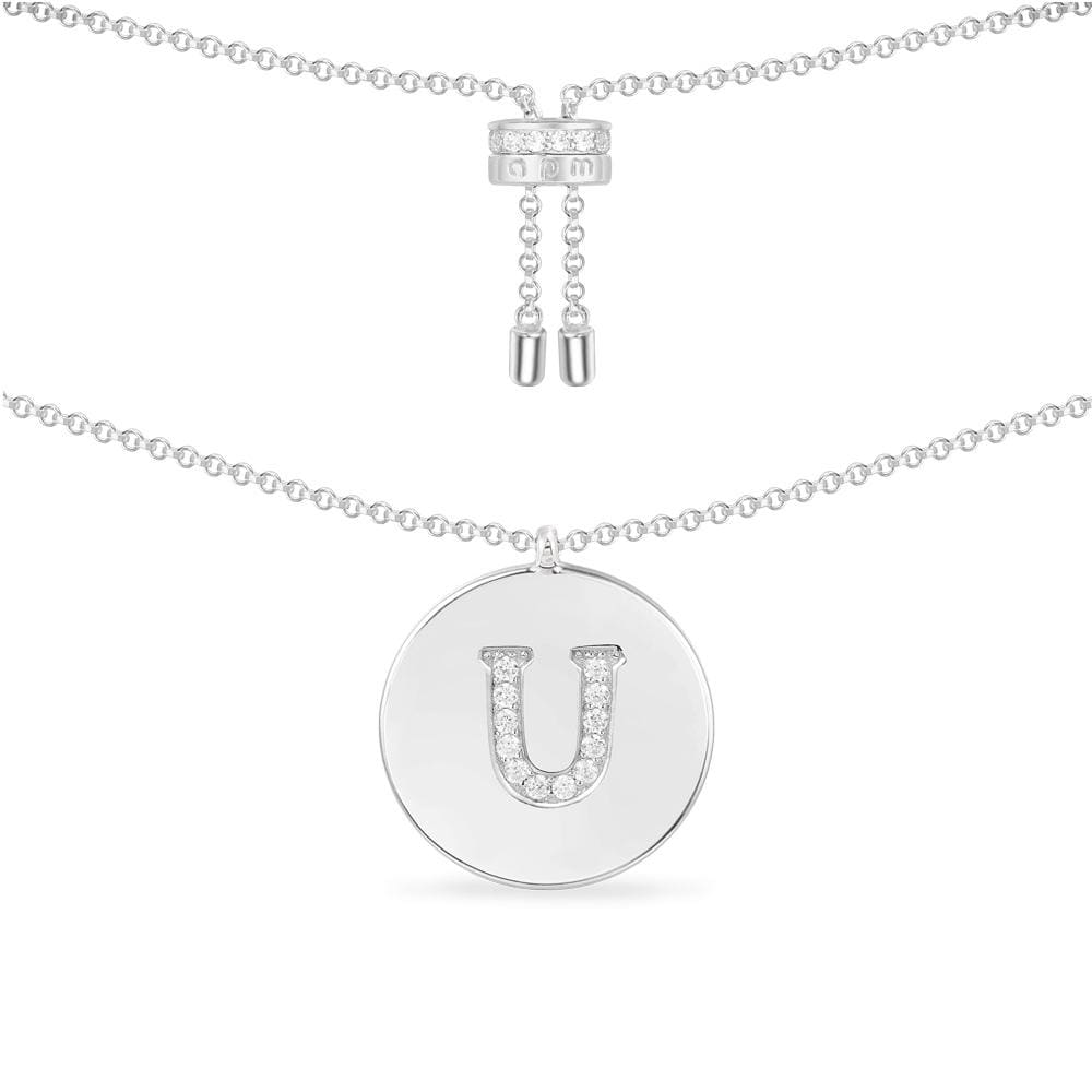 Necklaces APM Monaco: silver chain with a round pendant featuring a U-shaped letter in pavé diamonds.