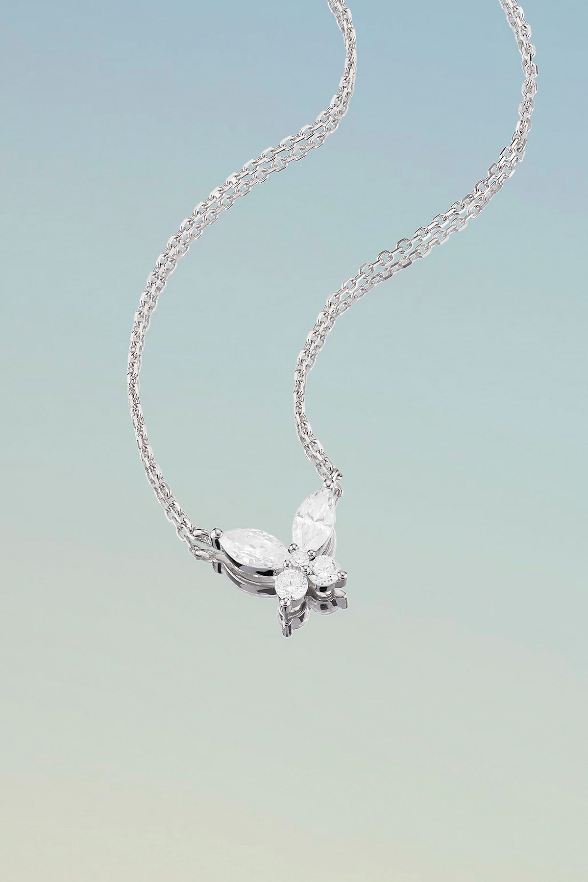 Necklaces APM Monaco, silver chain with a pavé white-diamond butterfly pendant.