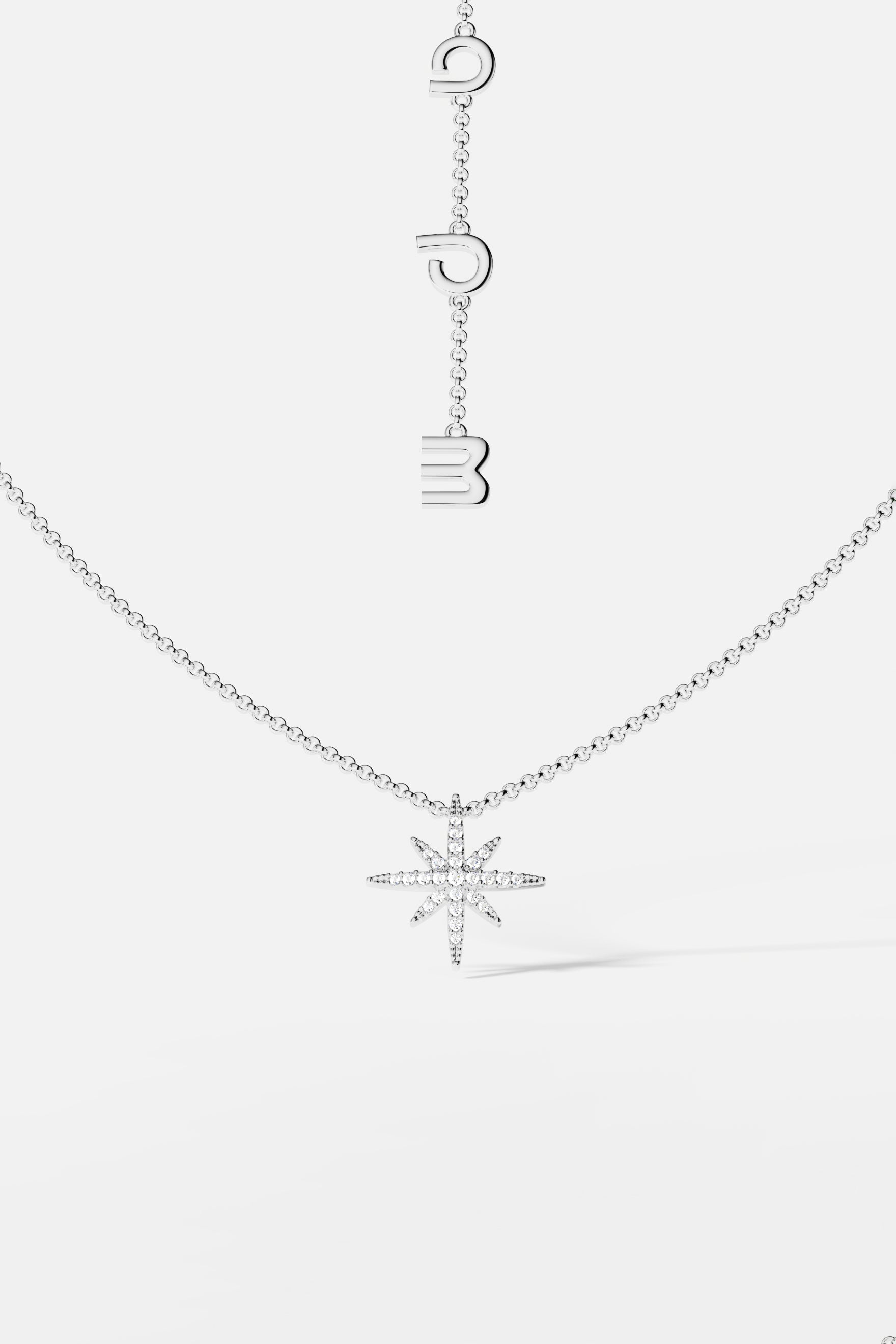 Necklaces APM Monaco, silver star-shaped pendant on a chain with meteorite texture.