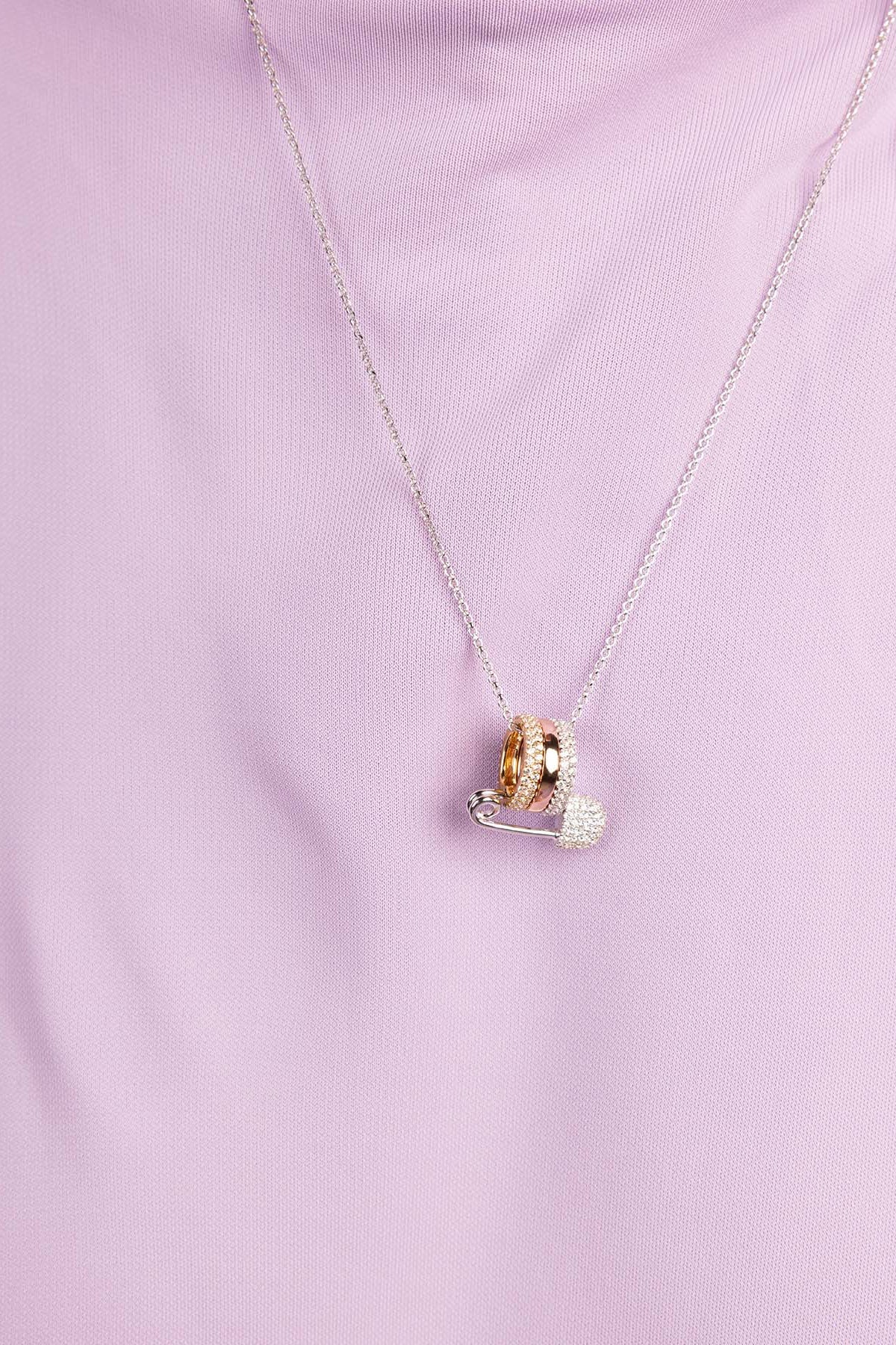 APM Monaco Safety Pin Adjustable necklace wearing a light purple top against a purple background