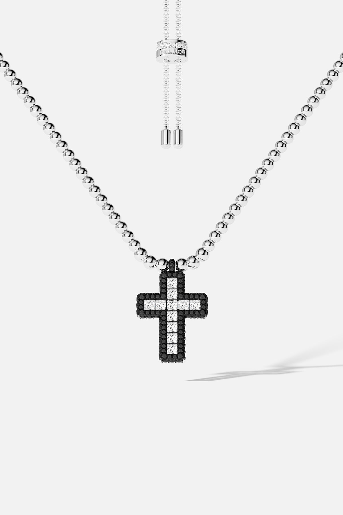 Necklaces APM Monaco: adjustable necklace with small silver beads and a pavé cross pendant in black and white stones.