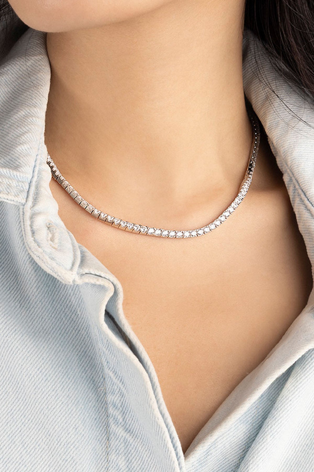 Necklaces APM Monaco white gold pavé tennis necklace with a chain of sparkling stones.