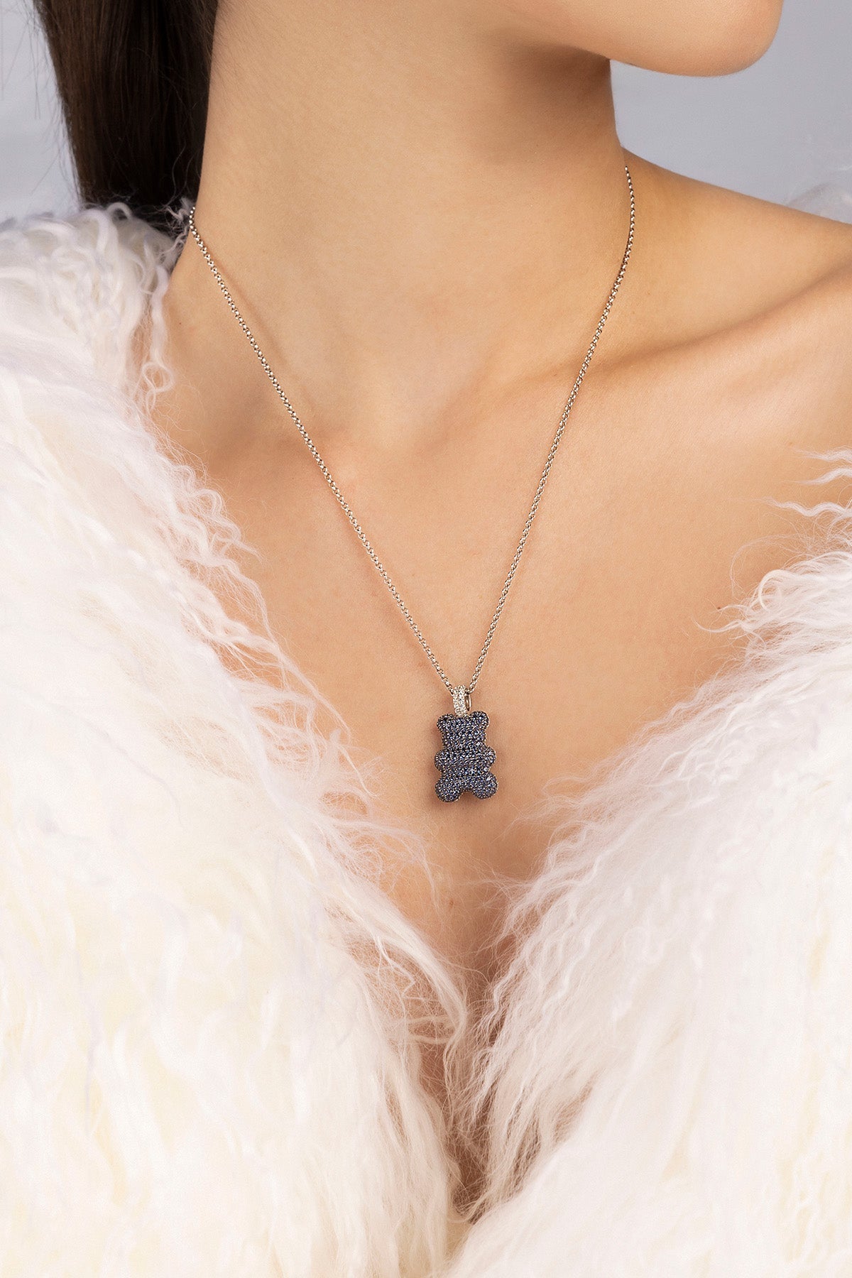 APM MONACO adjustable necklace with baby yummy bear pendant worn by a model against a neutral background