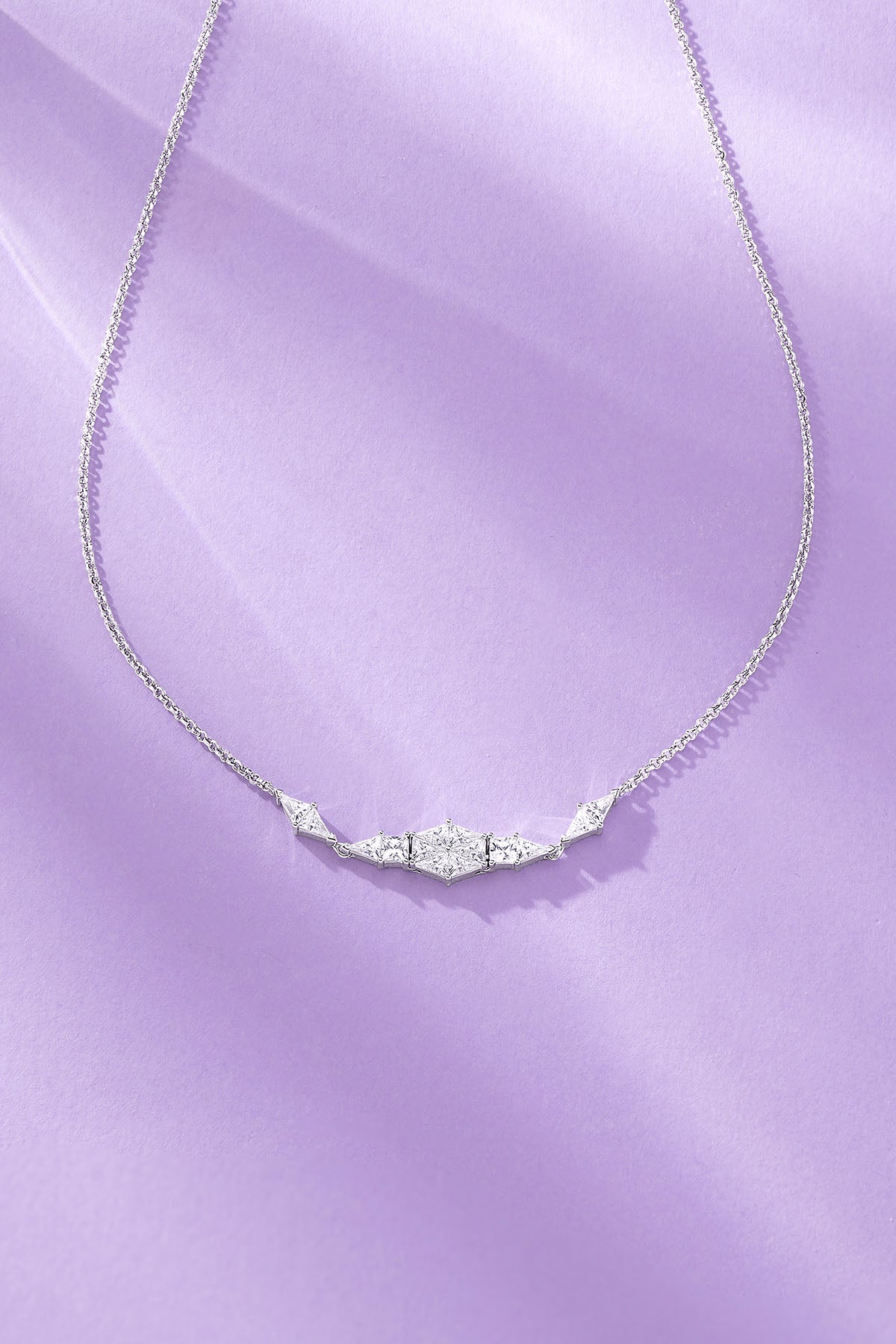 Art Deco Adjustable Necklace on a purple background