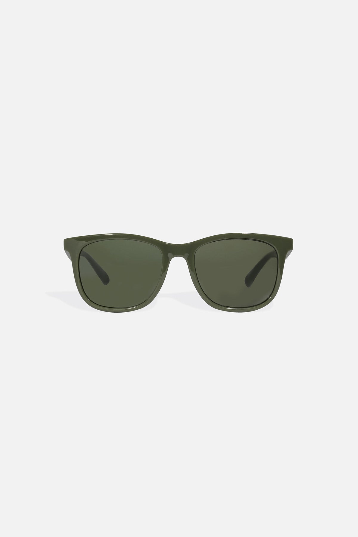 Green sunglasses on a light grey background
