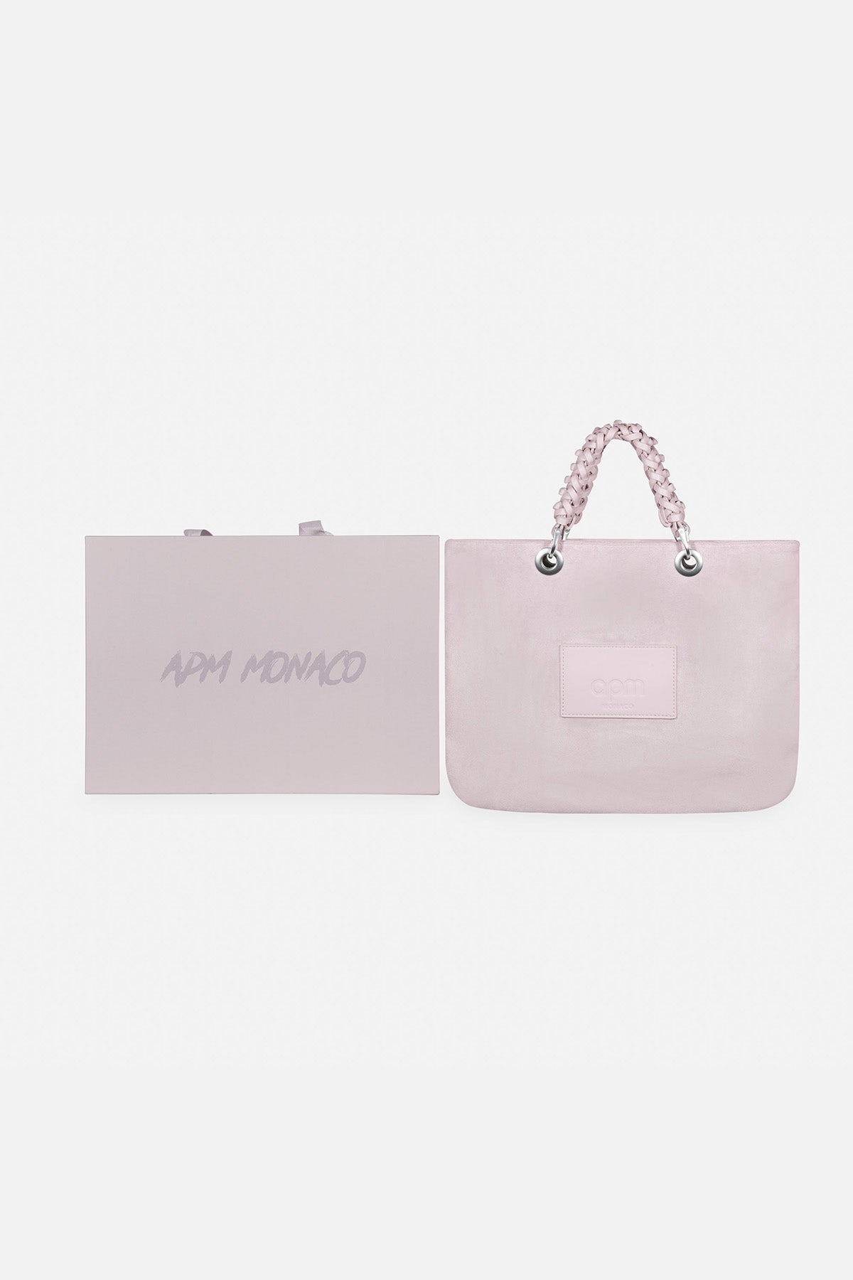 APM MONACO lavande handbag with a small square patch on a white background